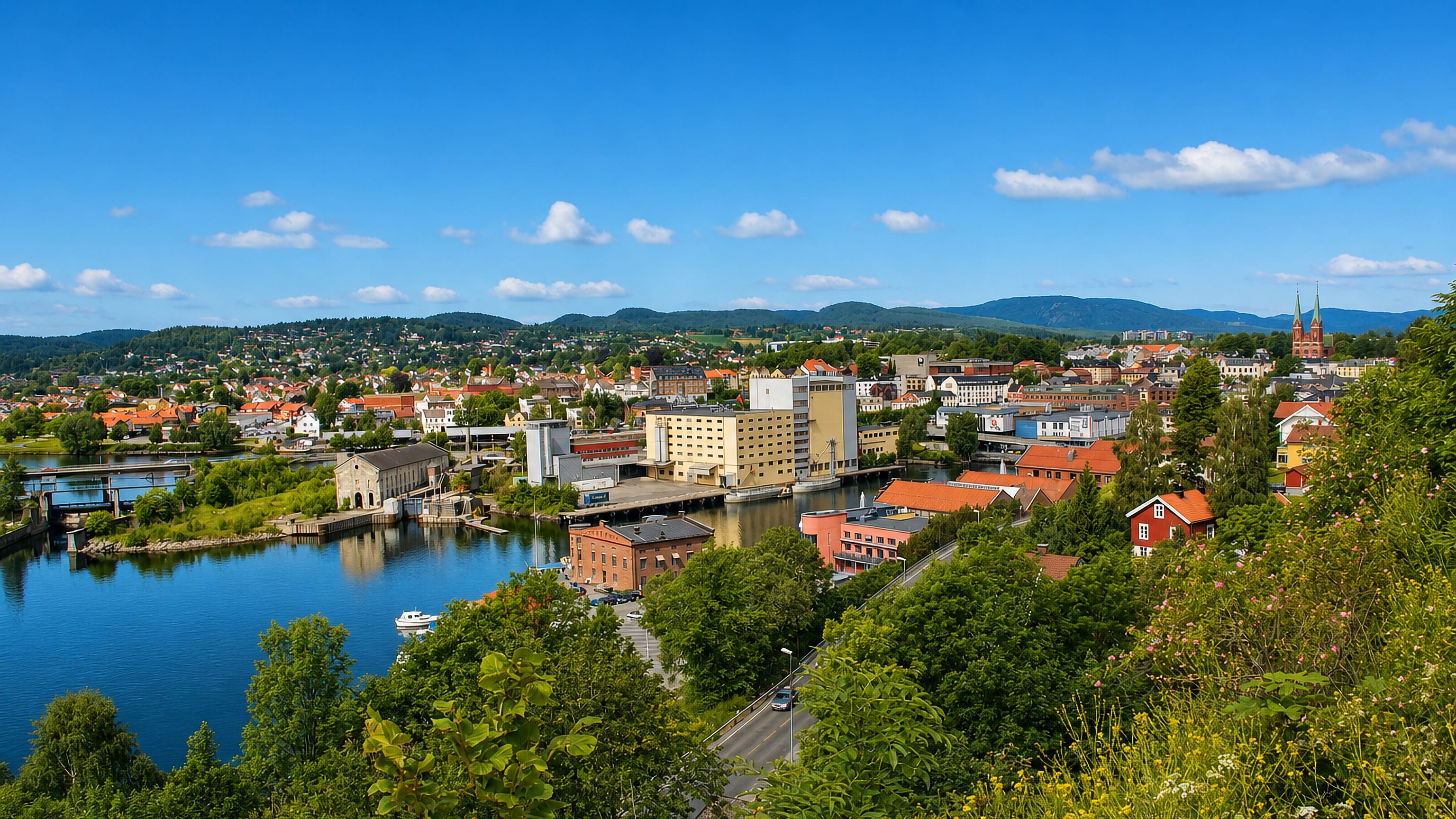 Riverside townscape of Skien with waterway, bridges and a church spire beneath green hills in Telemark