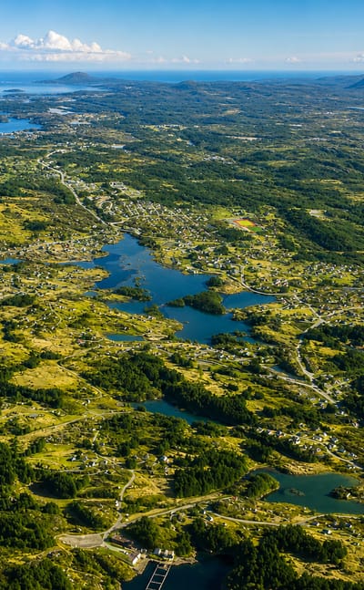 Aerial view of the green island archipelago, lakes and coastline around Svortland on Bomlo