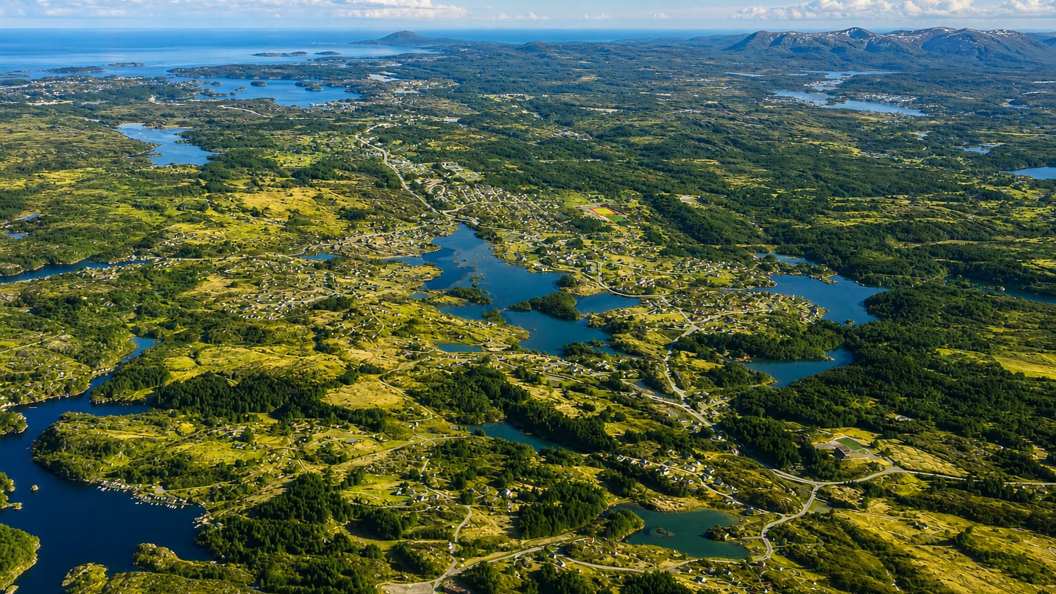 Aerial view of the green island archipelago, lakes and coastline around Svortland on Bomlo