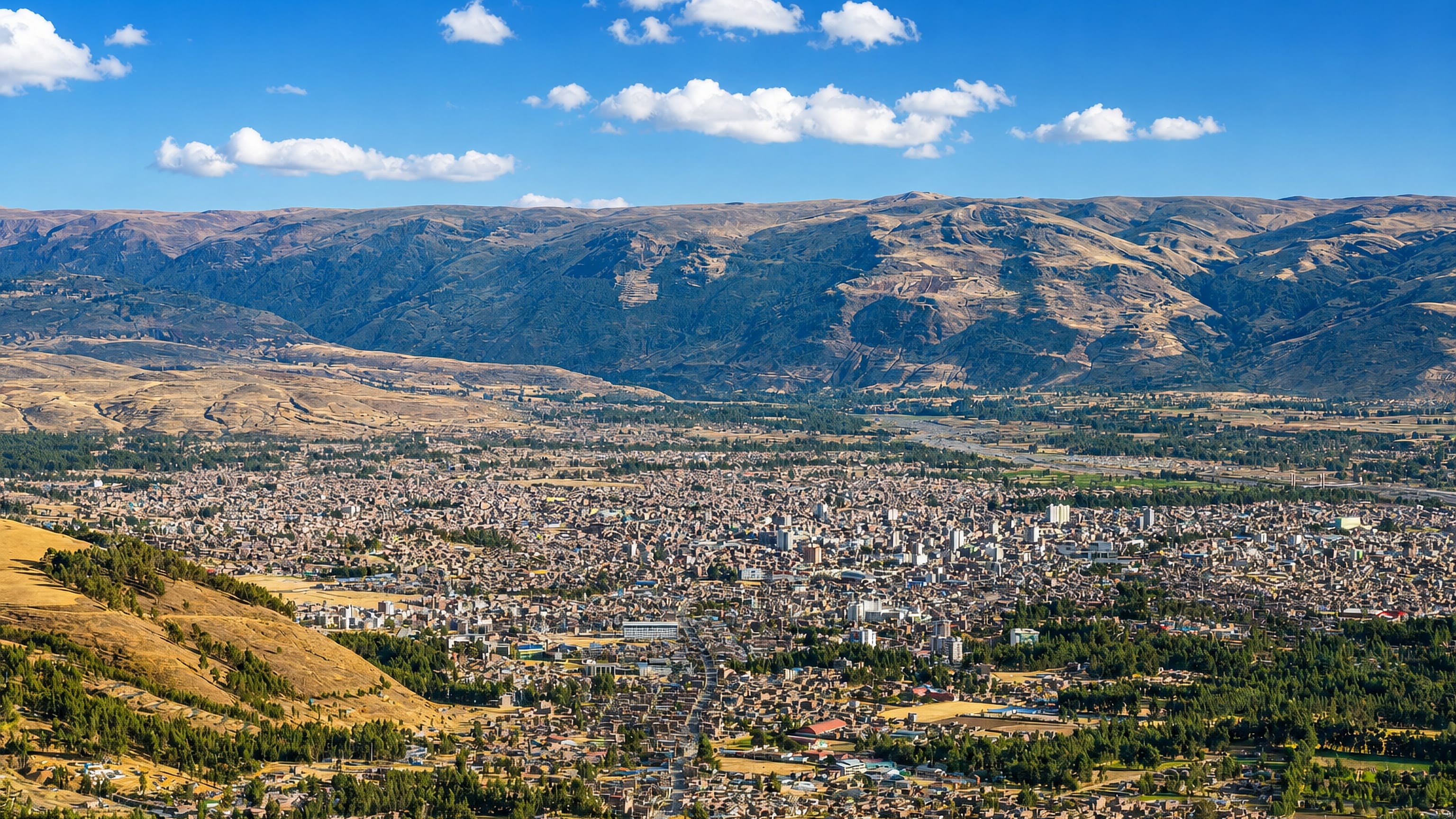 Huancayo, Peru, spreading across the Mantaro Valley floor beneath the brown ridges of the Andes.
