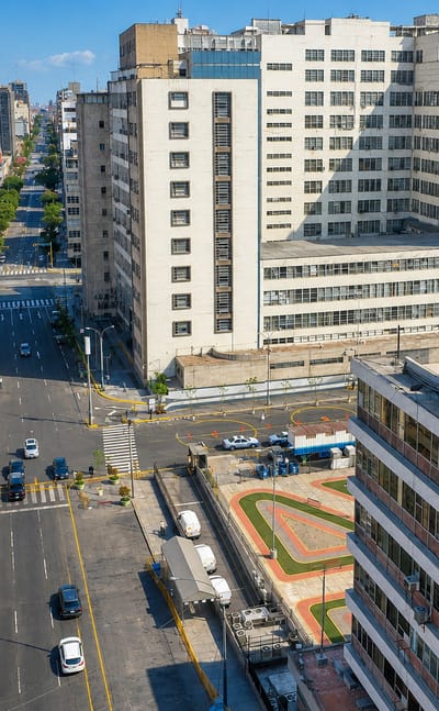 Aerial view of a dense downtown street grid and mid-rise buildings in Lima's Mesa Redonda commercial district