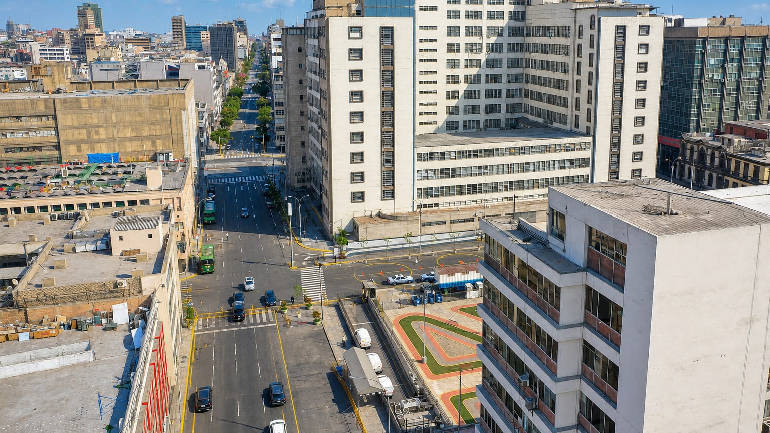 Aerial view of a dense downtown street grid and mid-rise buildings in Lima's Mesa Redonda commercial district