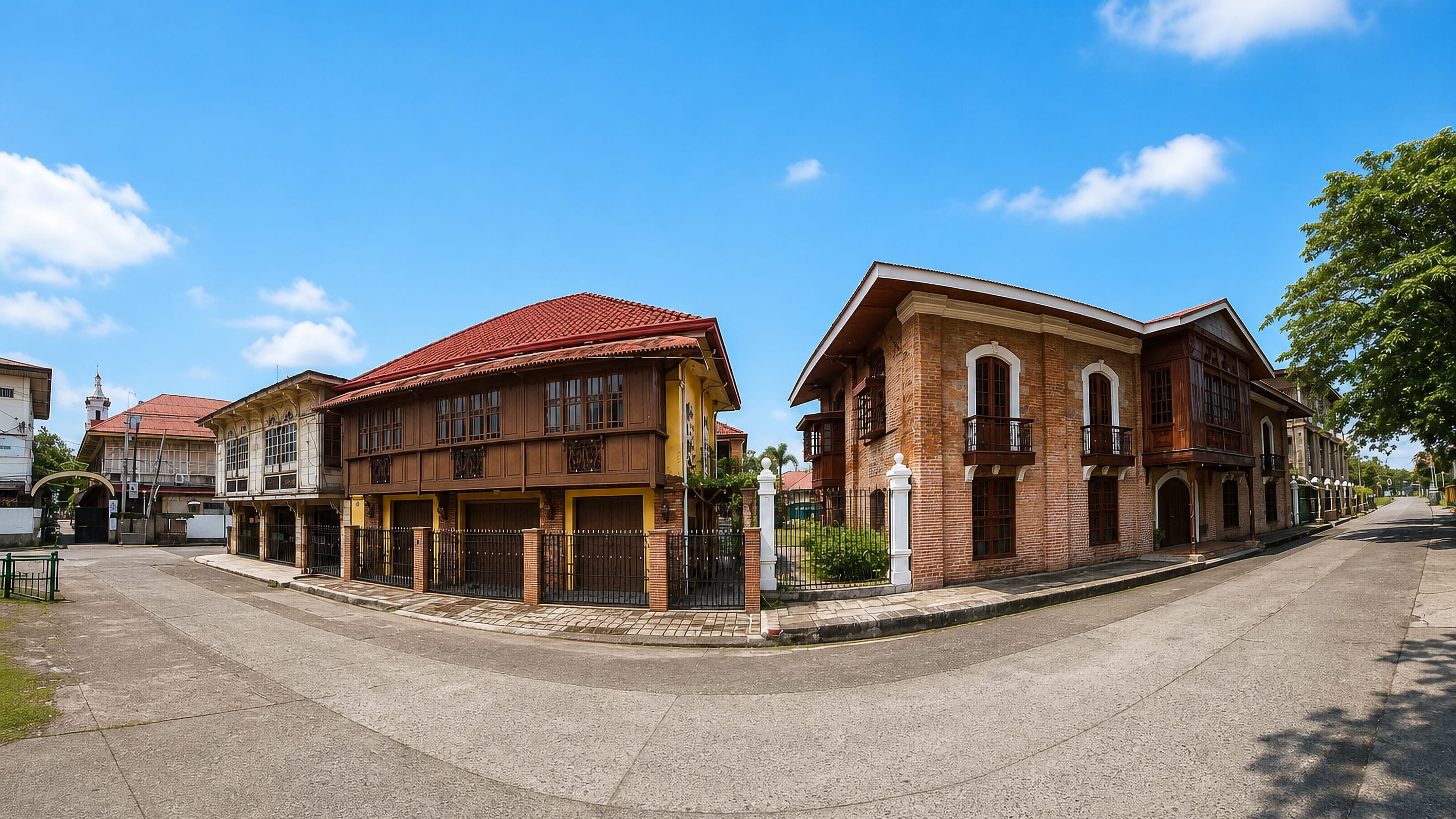 Spanish-colonial bahay na bato heritage houses on a quiet street corner in Gapan, Nueva Ecija.