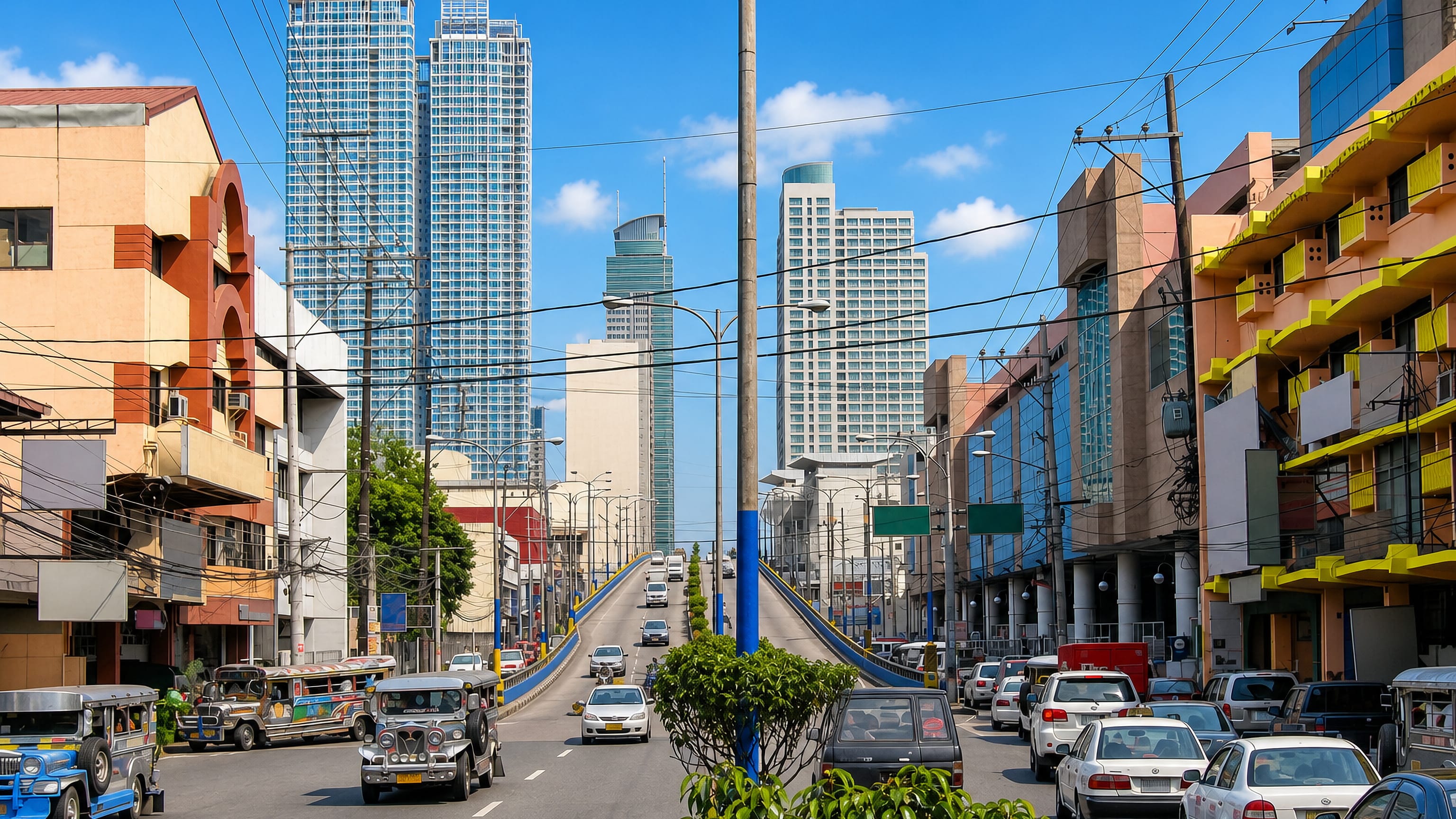 Jeepneys and traffic on a Mandaluyong City thoroughfare below glass condominium towers, Metro Manila.