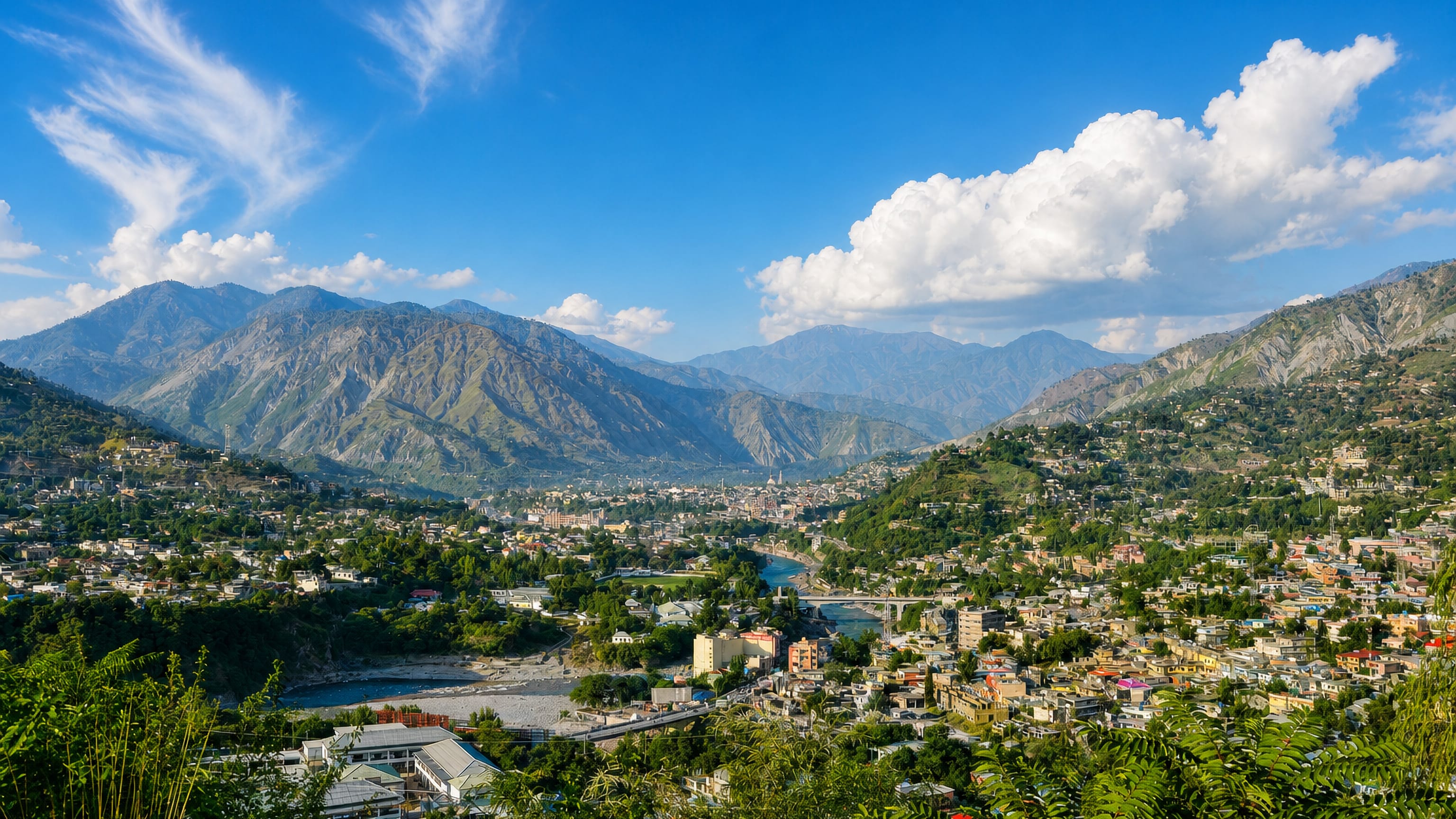 Muzaffarabad spread across the river confluence below the green mountains of Azad Kashmir, Pakistan
