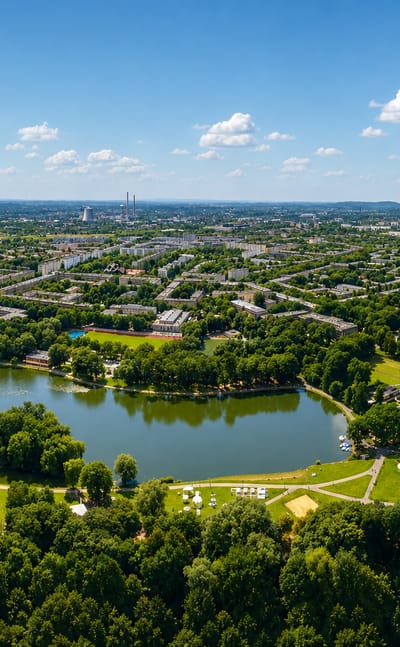 Aerial view of the Nowa Huta district of Krakow with its lagoon, parkland and planned housing blocks