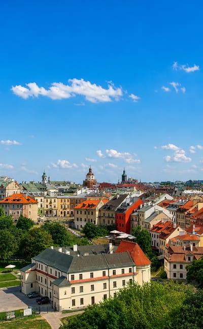 Lublin Old Town skyline with the green-domed Trinitarian Tower and cathedral among red roofs