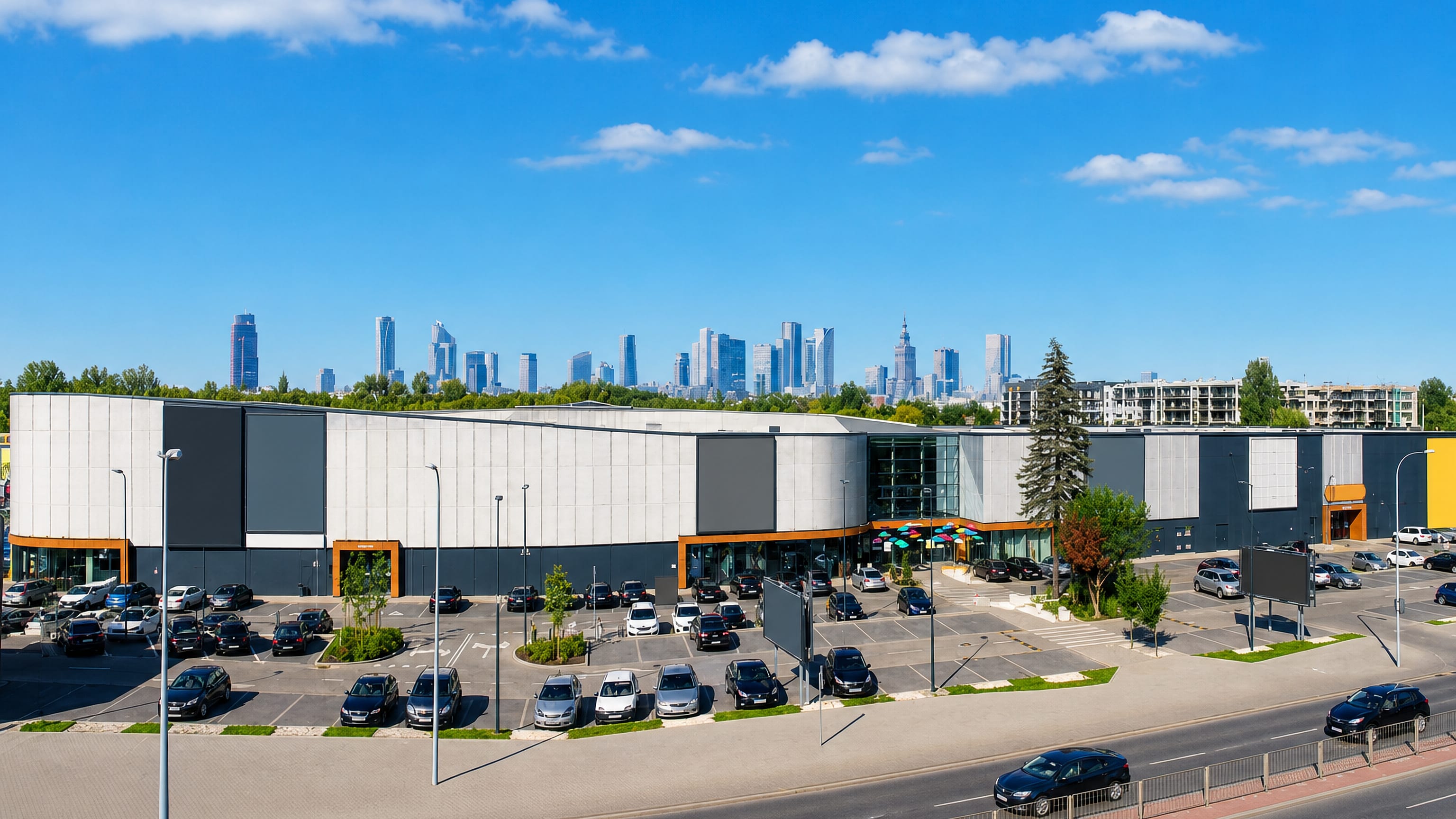 Retail park and car park at Raków, Warsaw, with the city's downtown skyscrapers on the horizon.
