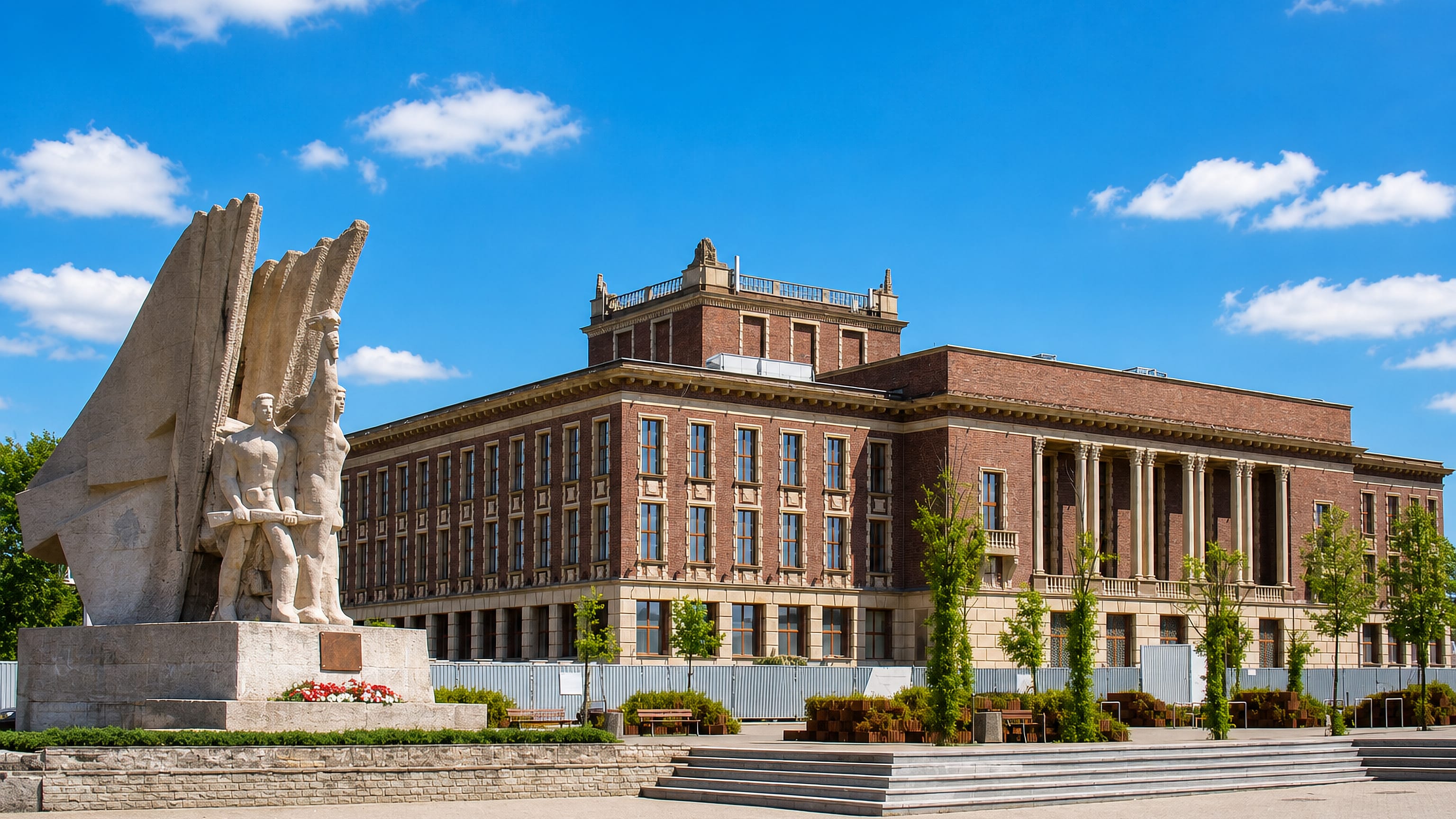 The Palace of Culture of Zagłębie in Dąbrowa Górnicza, Poland, with its socialist-realist workers' monument.