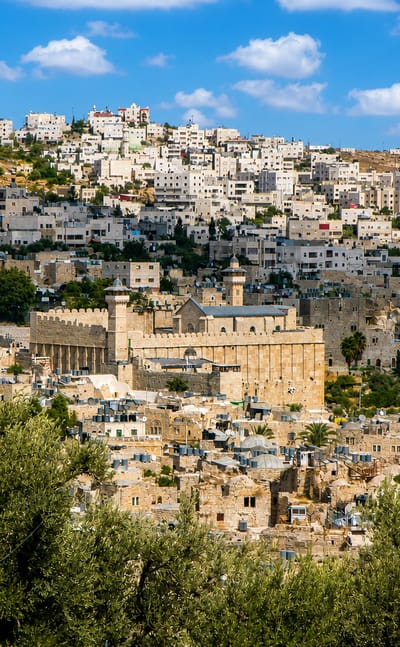 Hebron's old city on the hillside around the stone Cave of the Patriarchs and its minaret.