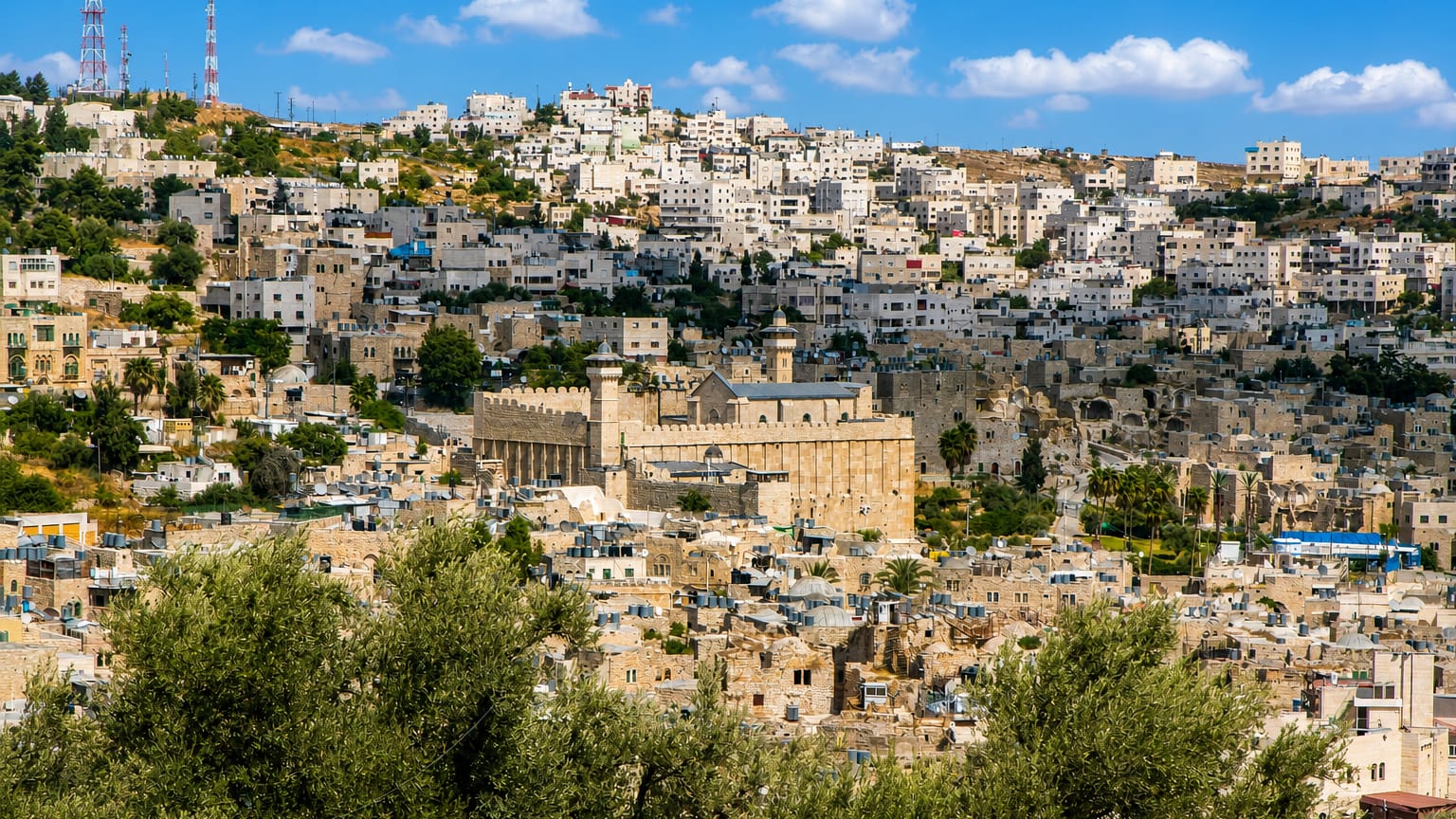 Hebron's old city on the hillside around the stone Cave of the Patriarchs and its minaret.