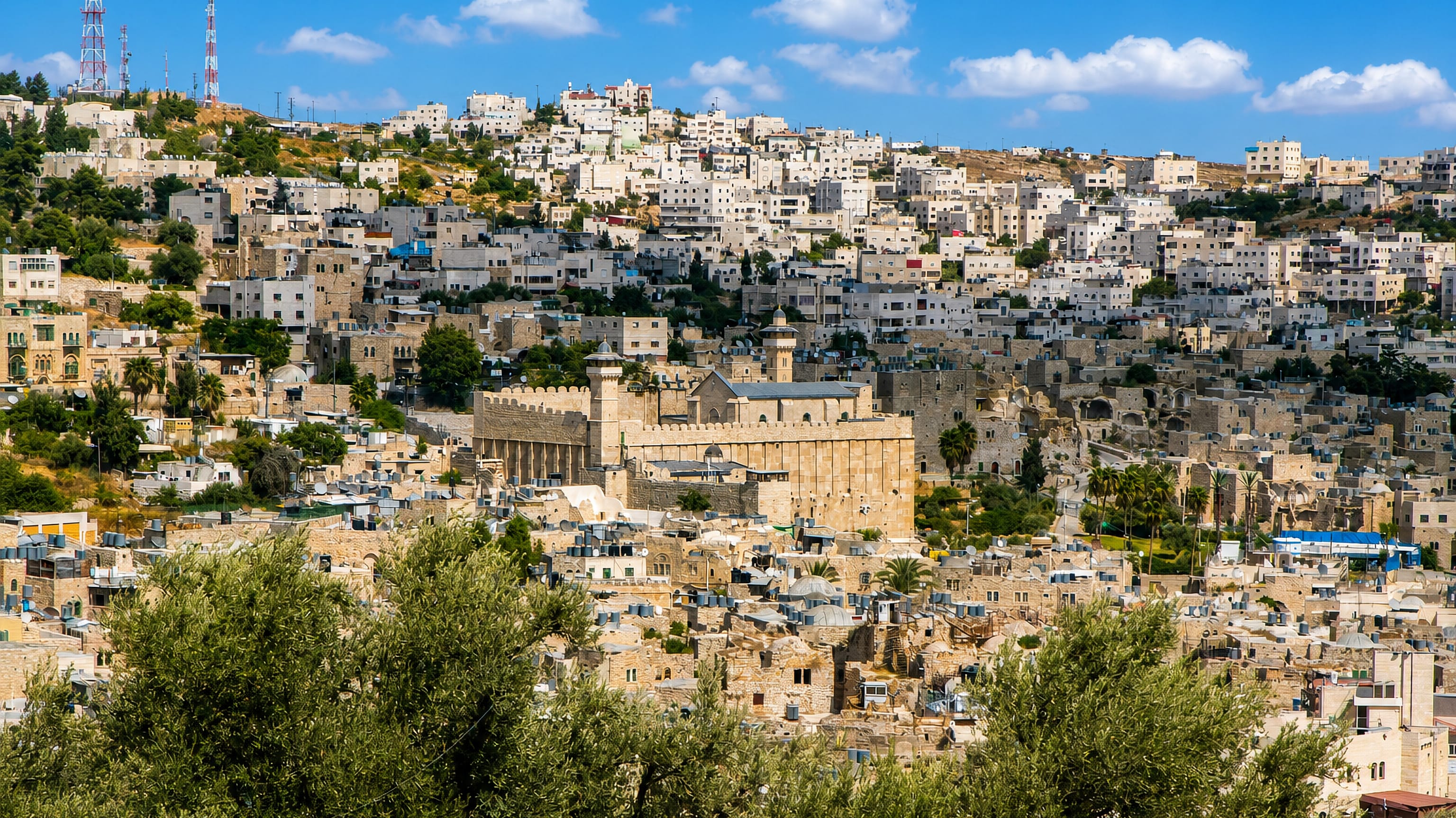 Hebron's old city on the hillside around the stone Cave of the Patriarchs and its minaret.