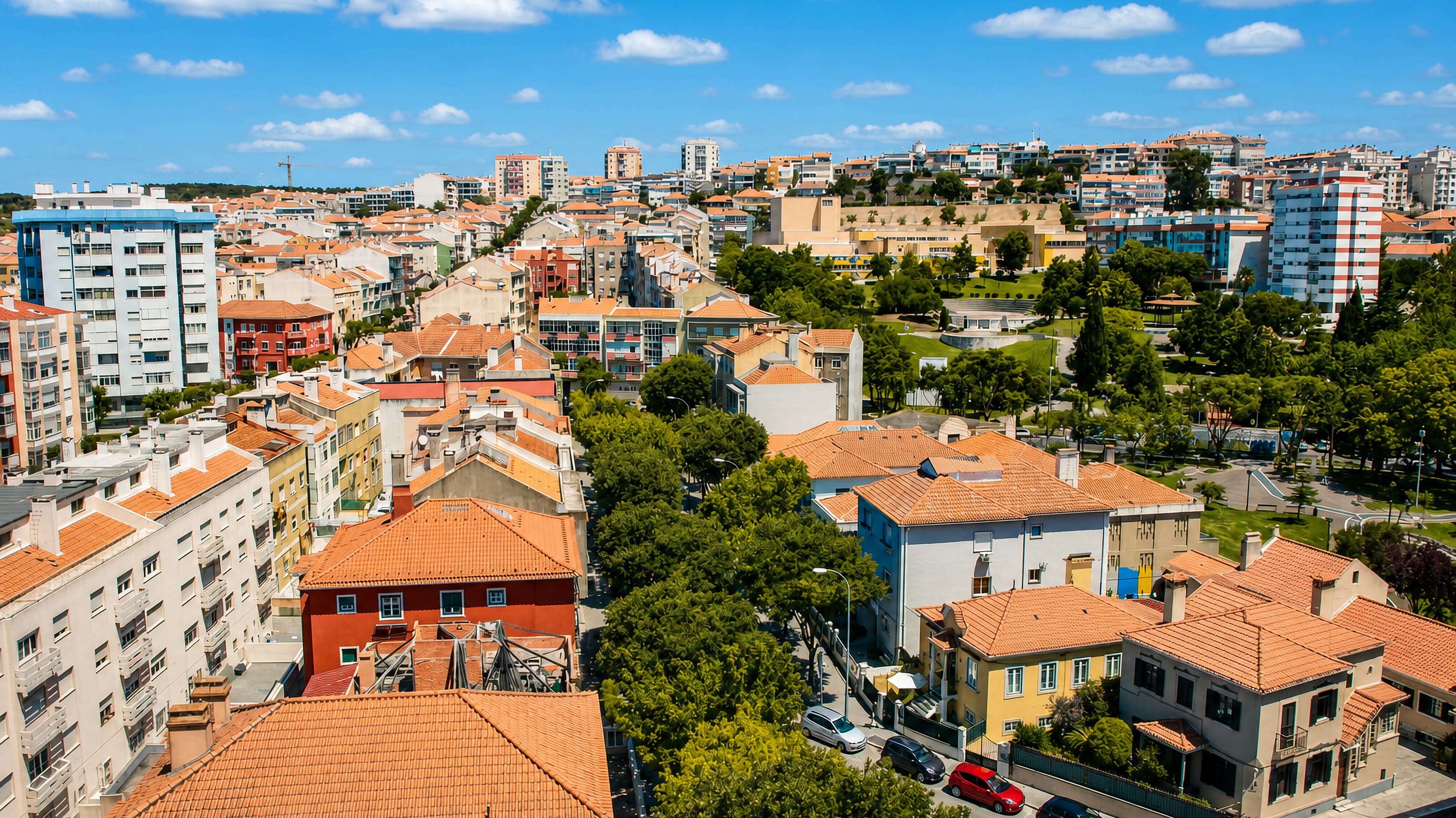 Terracotta rooftops and apartment blocks packed across the hills of Amadora, outside Lisbon.