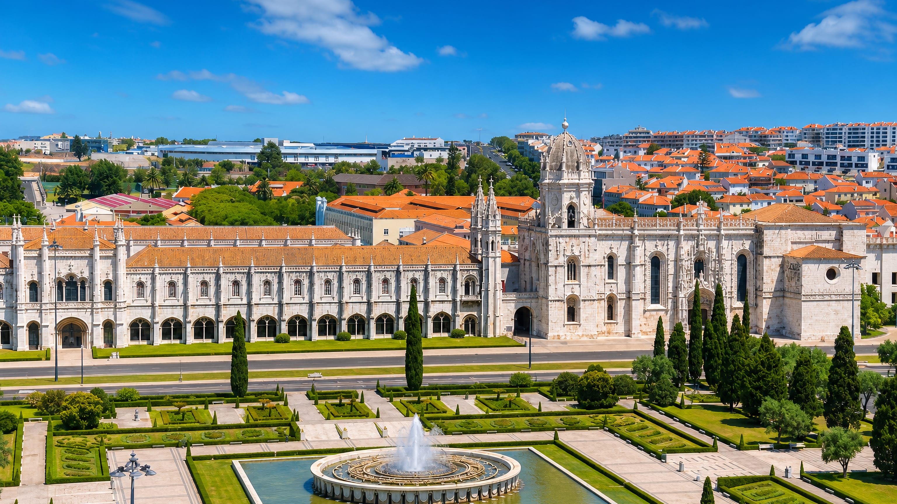 Jeronimos Monastery and the fountain gardens of Praca do Imperio in Belem, Lisbon.