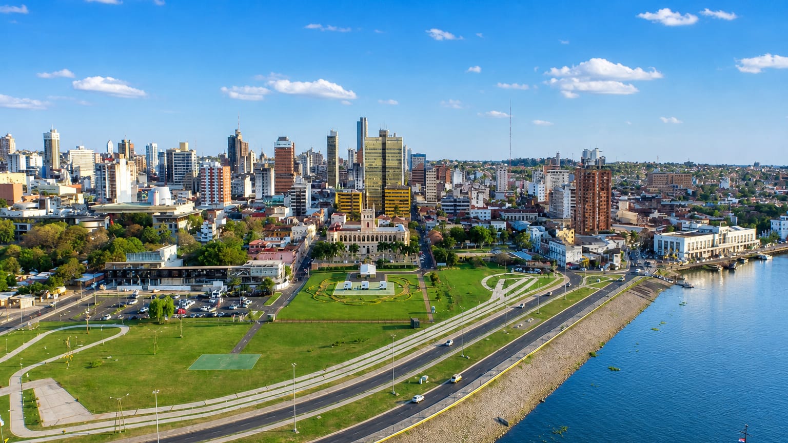 Asuncion's waterfront park and skyline with the white Palacio de los Lopez by the Paraguay River.