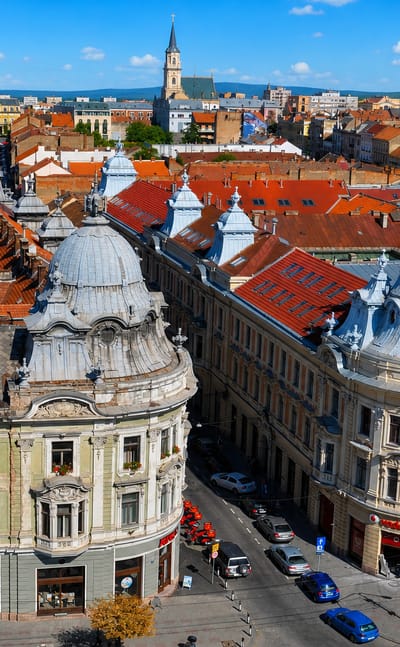 Cluj-Napoca's historic centre with domed Baroque buildings, red roofs and church spires, Romania