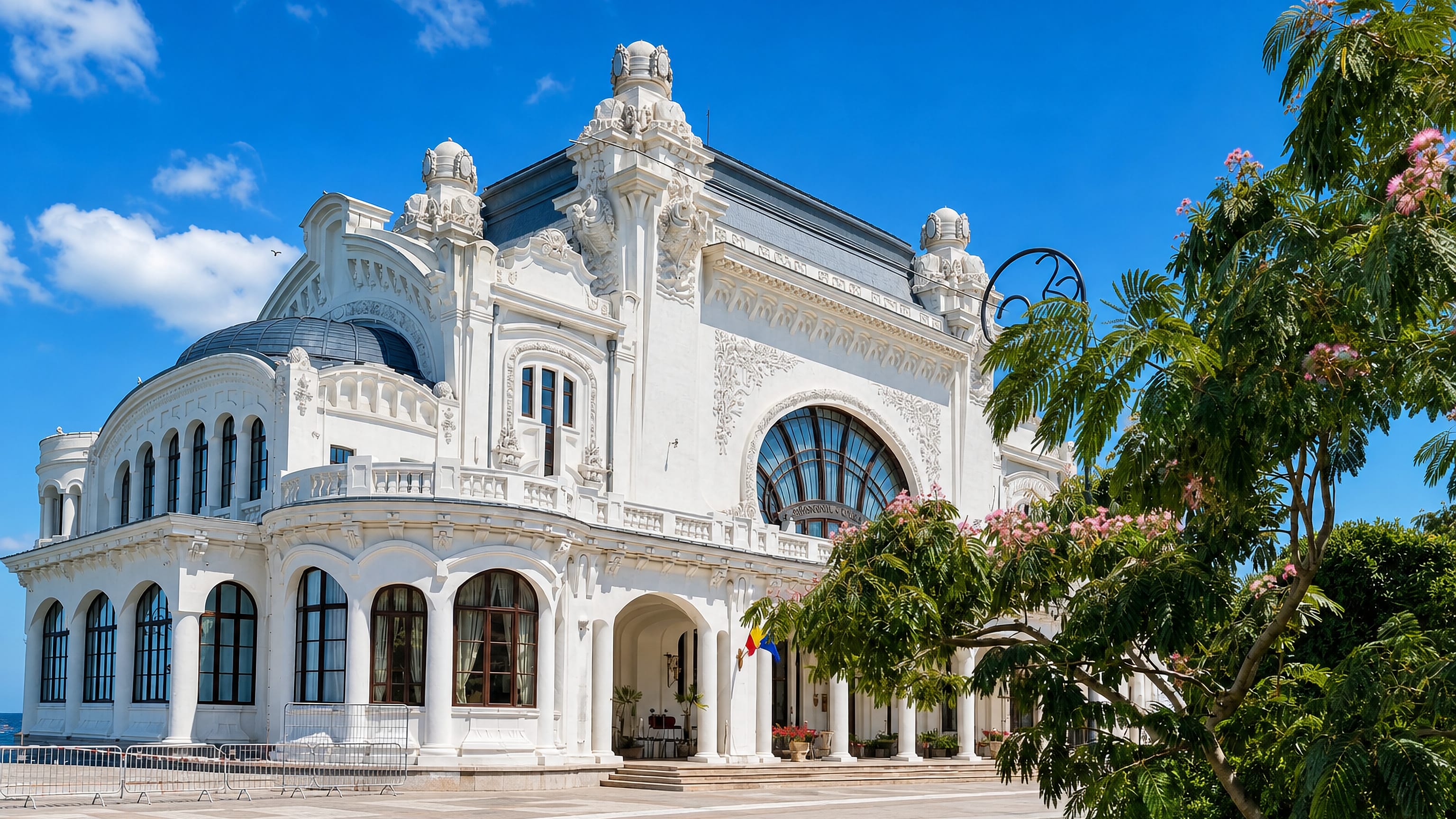 Constanța's restored Art Nouveau casino on the Black Sea seafront under a bright blue summer sky