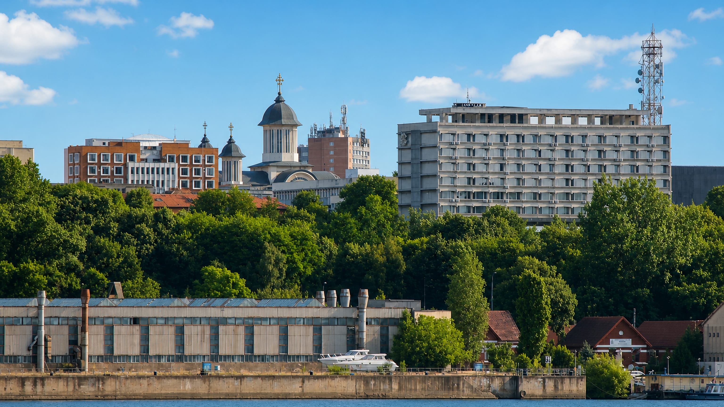 Drobeta-Turnu Severin seen across the Danube, with its cathedral dome and riverside quays.
