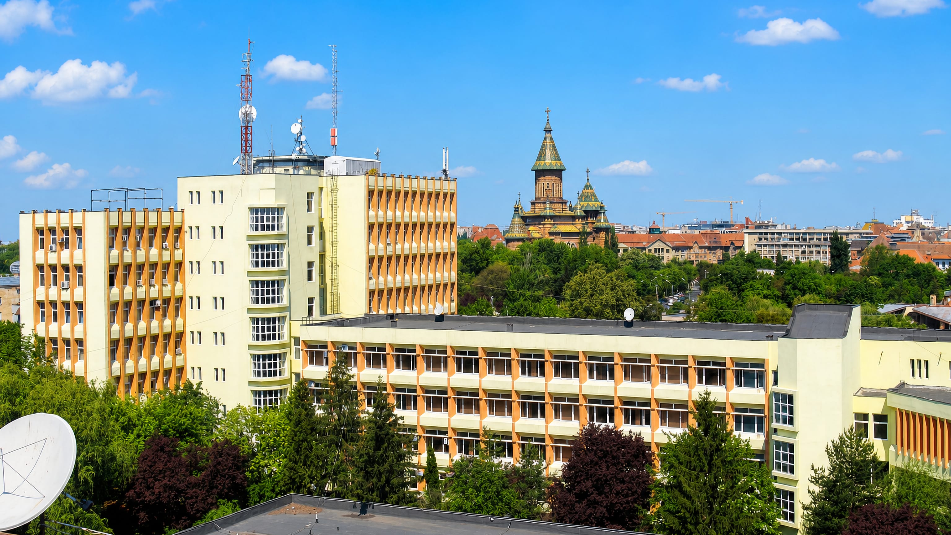 Apartment blocks in Timisoara's Elisabetin district with the Orthodox Cathedral's tiled towers behind