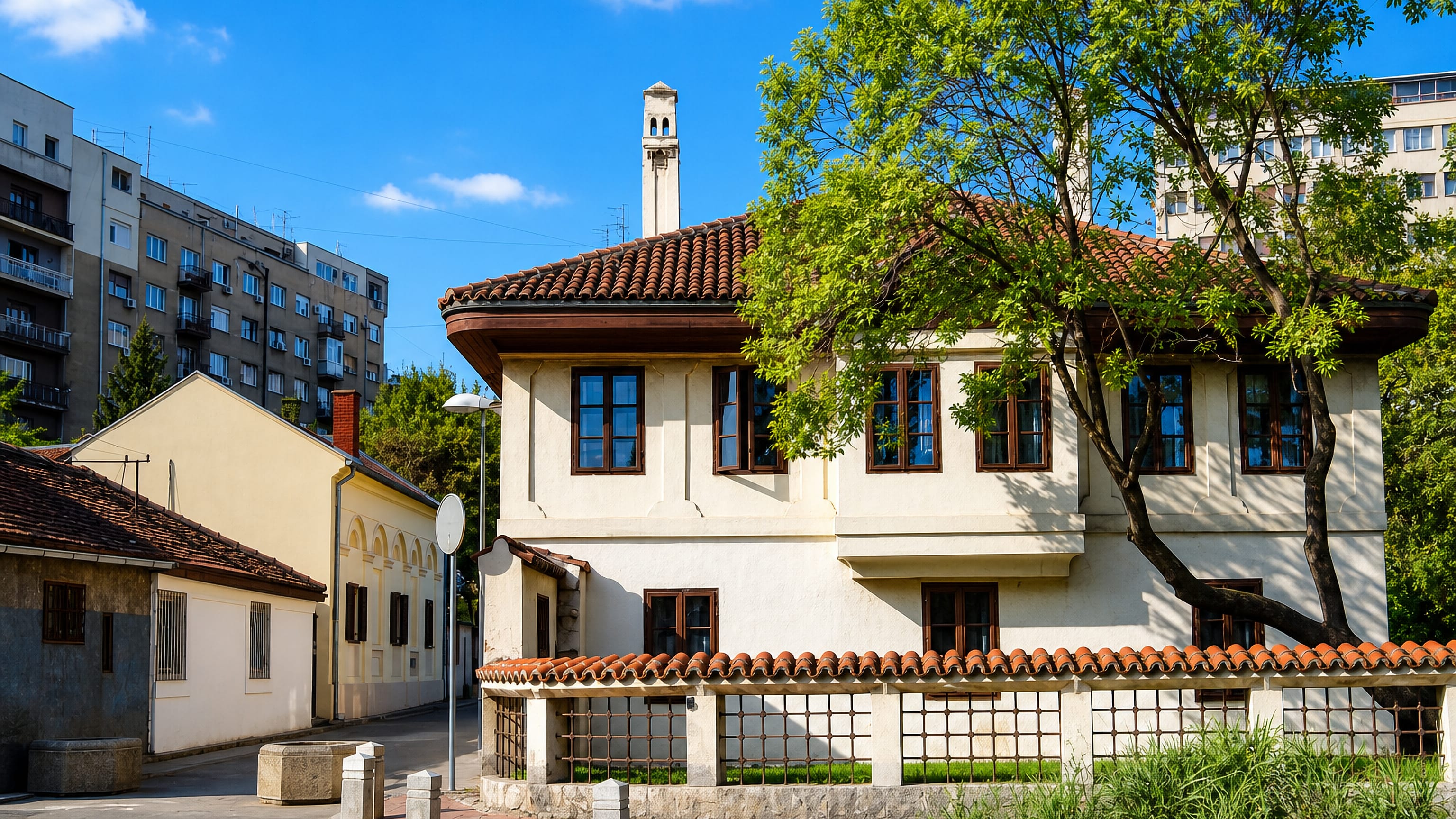 The area around Dositej's Lyceum in Belgrade, with a Balkan-style townhouse and walled courtyard below a minaret.