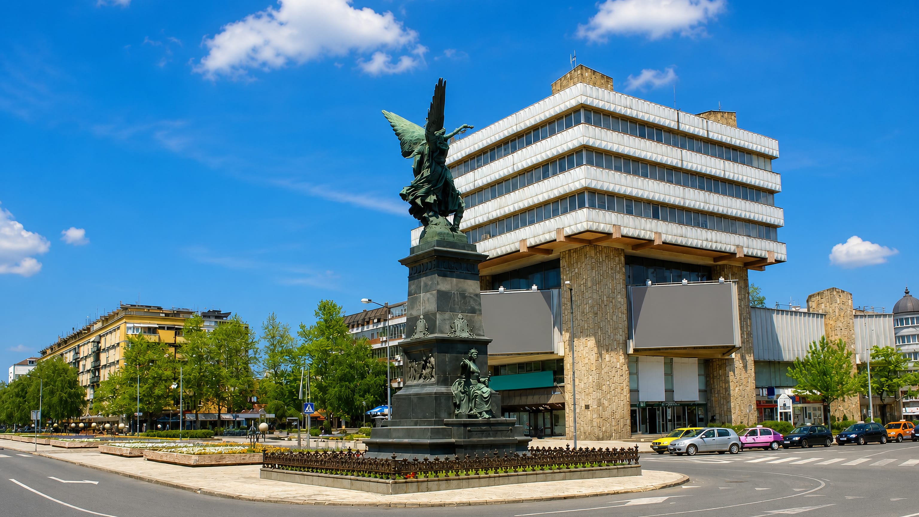 Winged Kosovo Heroes monument and modernist buildings on the central square of Krusevac, Serbia.