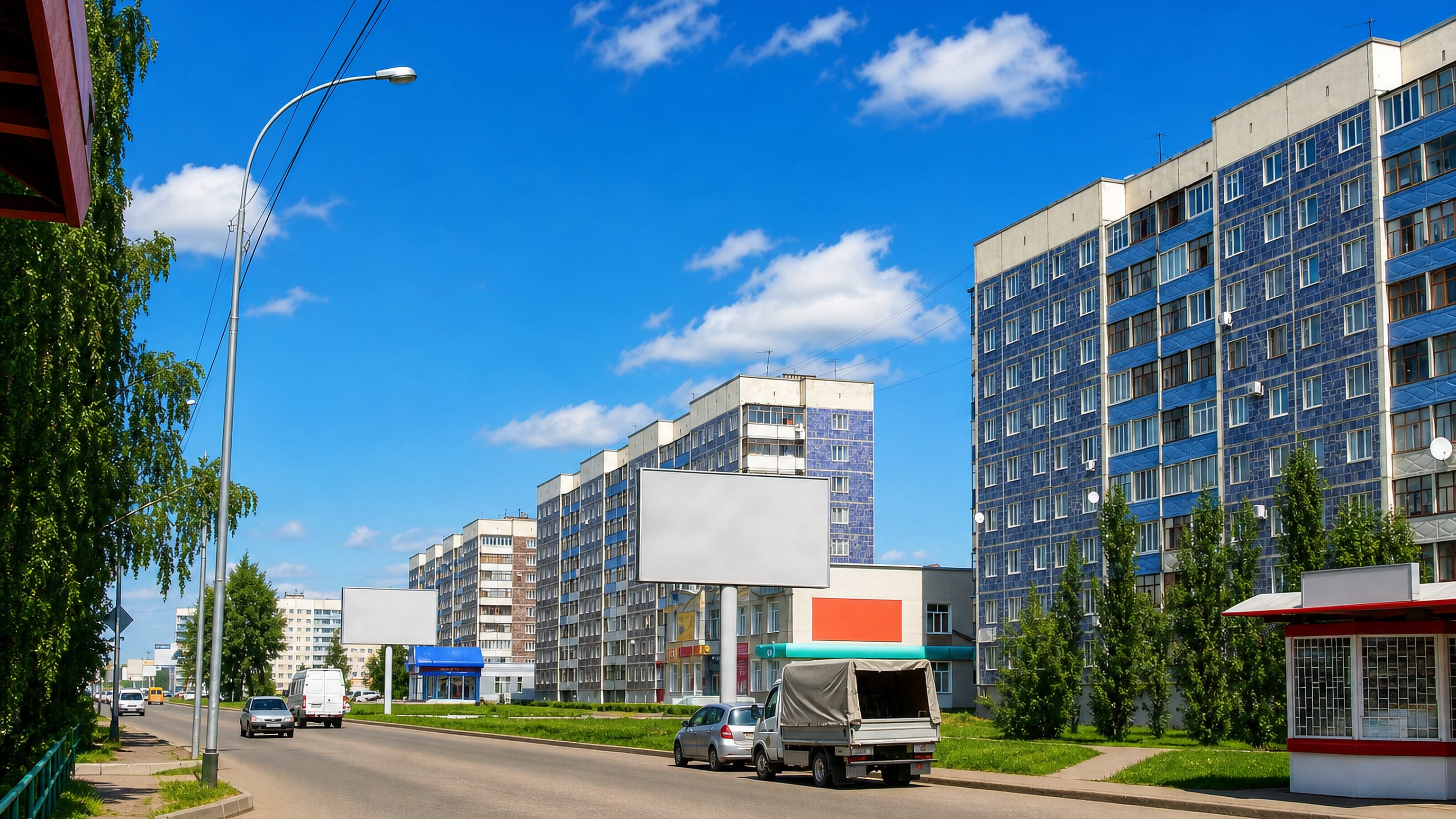 Panel apartment blocks, a roadside kiosk and a wide street in the Soviet-planned city of Salavat, Bashkortostan.