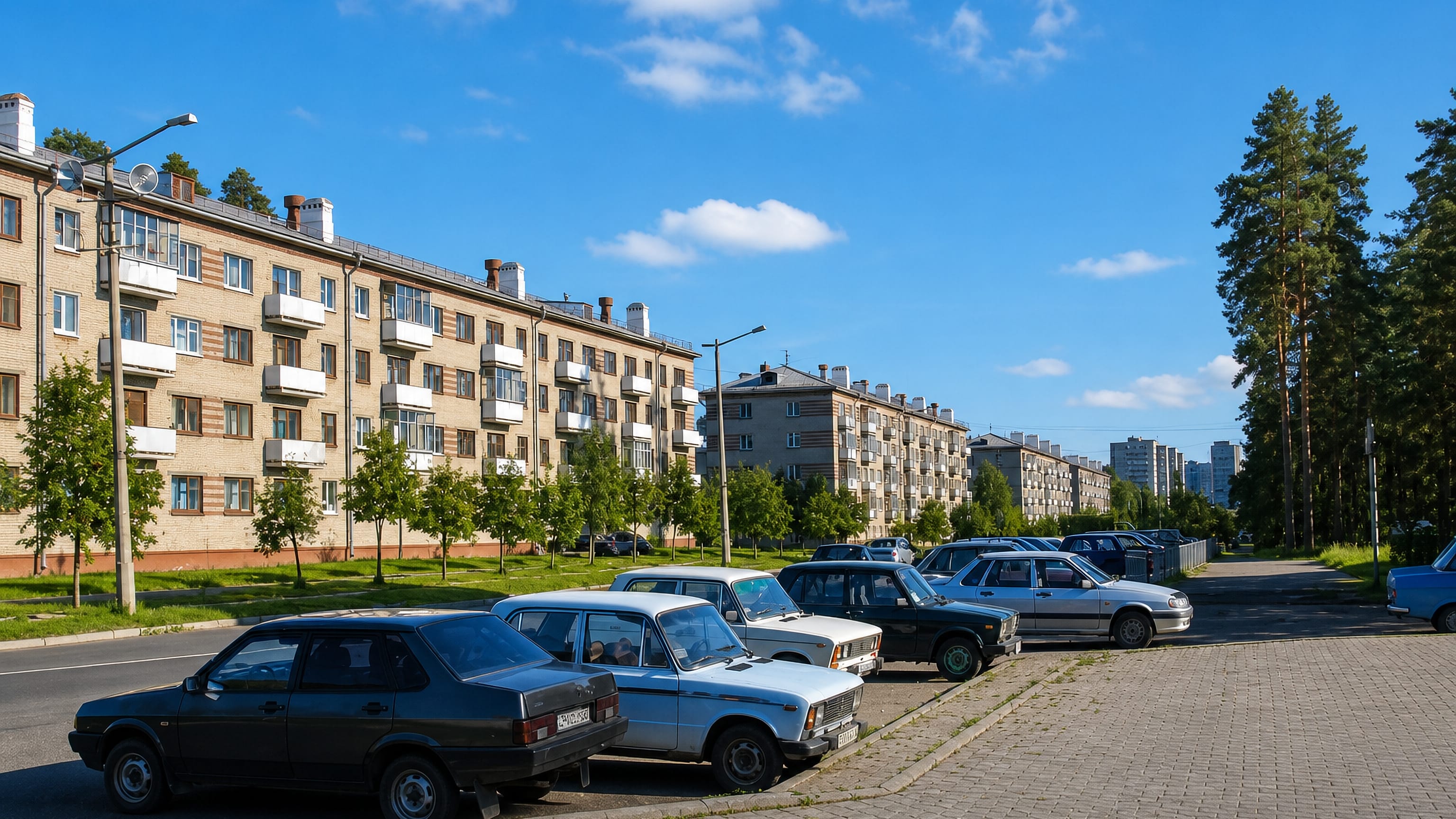 Soviet-era low-rise apartment blocks and tall pines lining a quiet parking street in Snezhinsk, Russia.