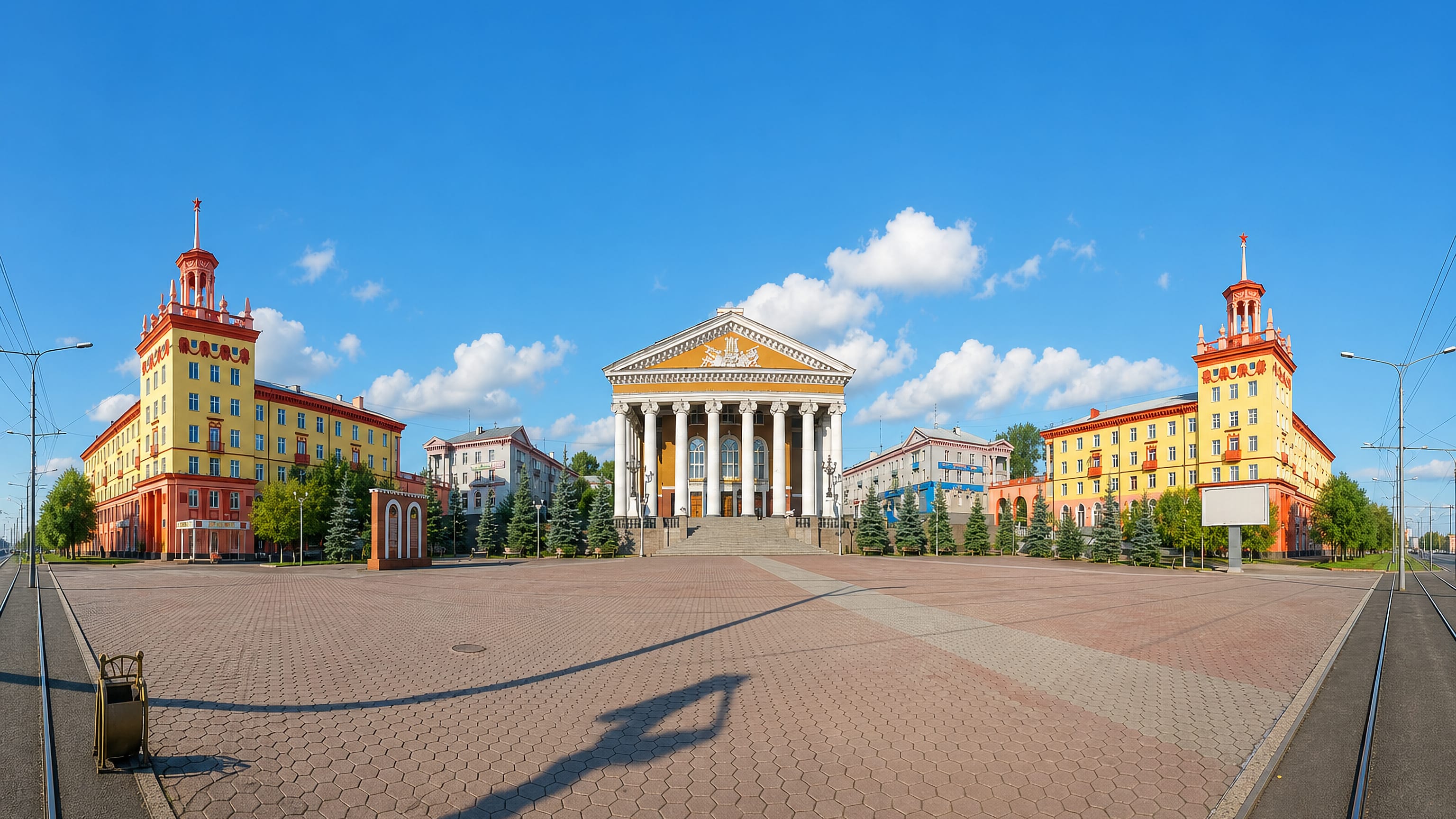 Spired Stalinist blocks flanking the columned Palace of Culture on the main square of Prokopyevsk, Russia.