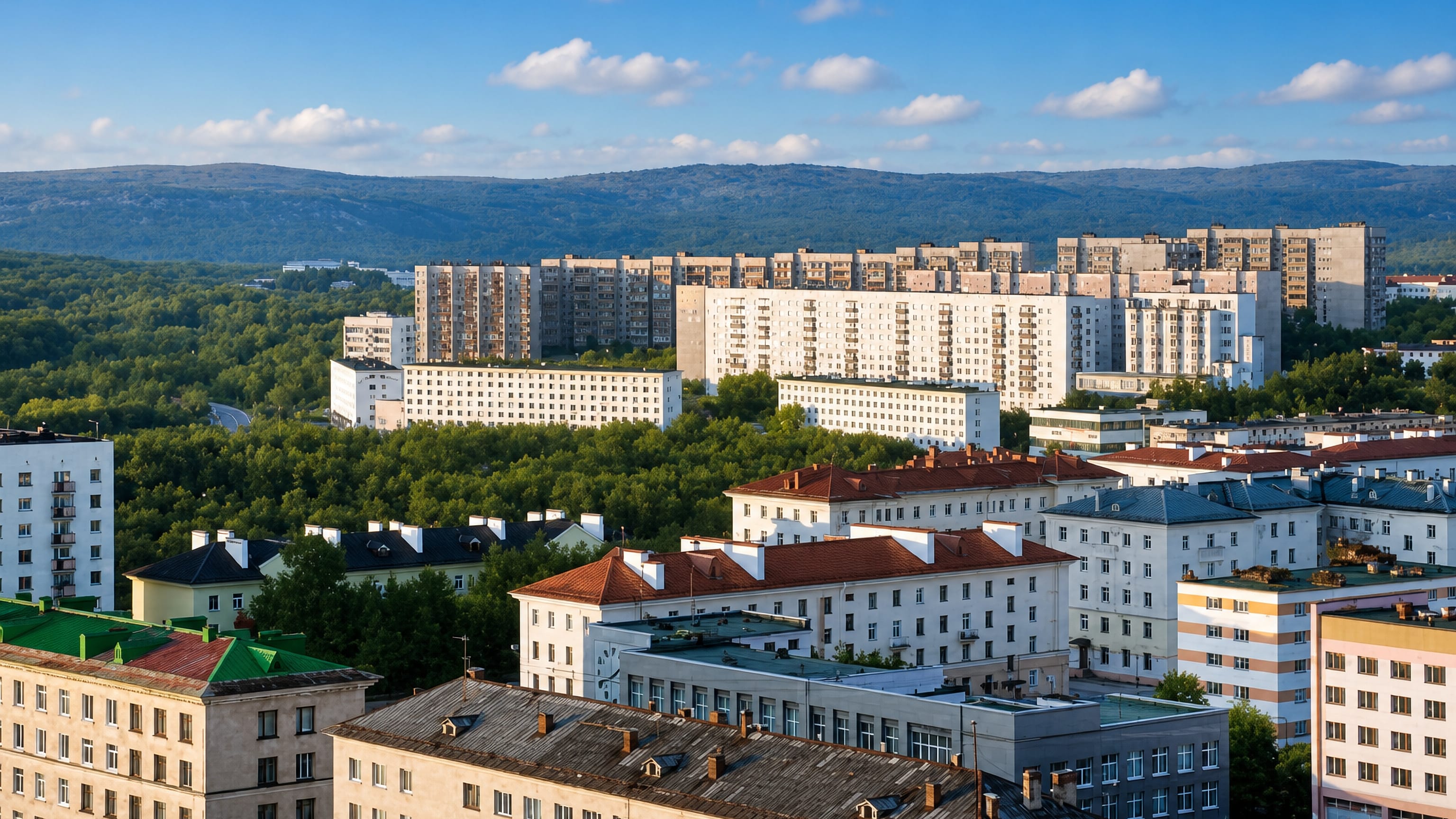Soviet-era apartment blocks and wooded hills above the town centre of Severomorsk, Russia