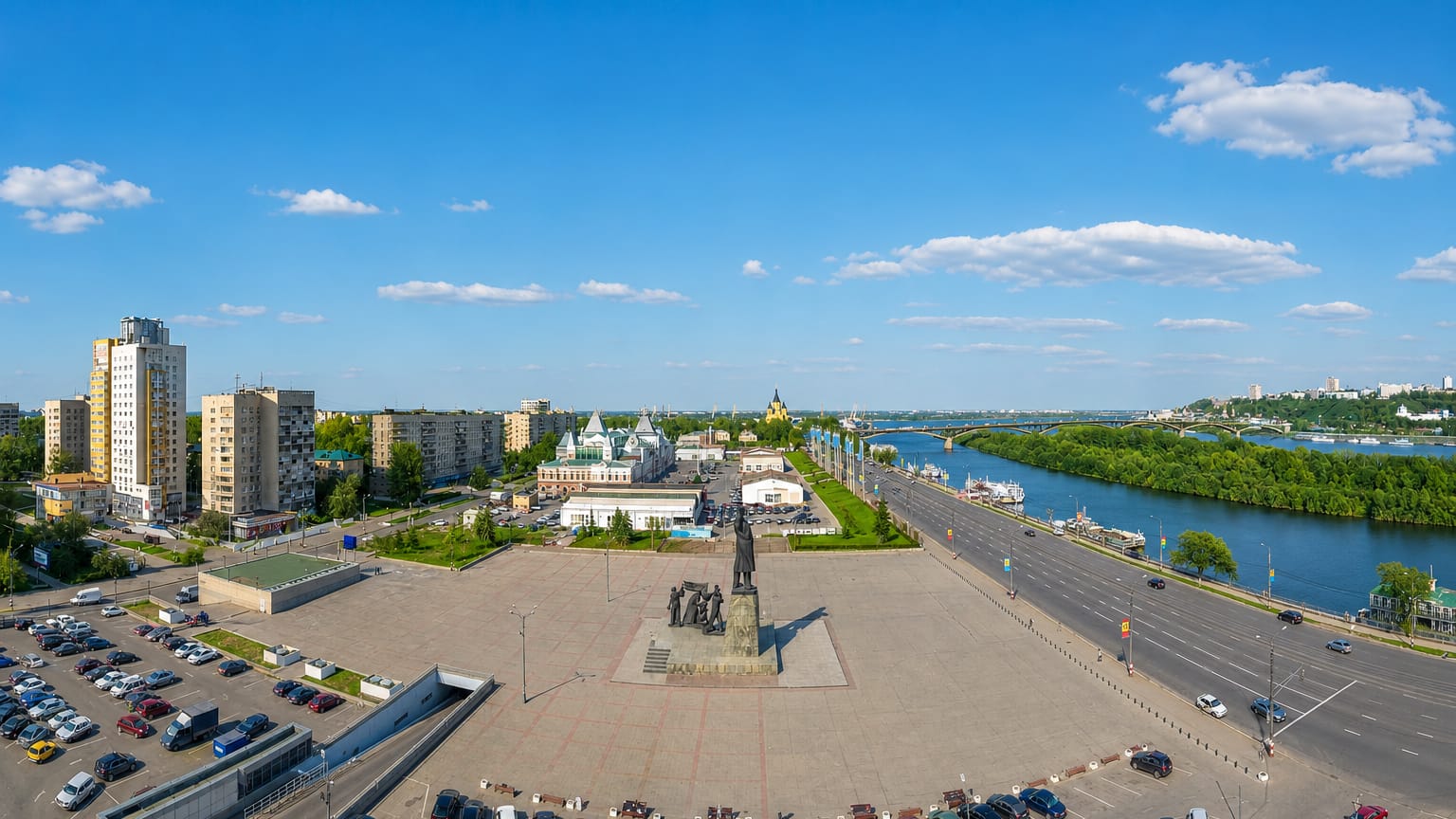 Nizhny Novgorod's fair square with the ornate Main Fair House and Alexander Nevsky Cathedral by the Oka River.
