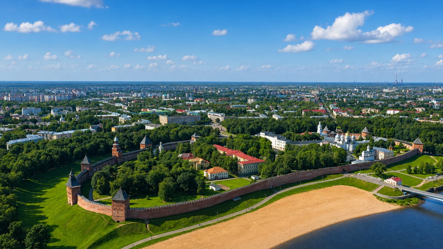Aerial view of Velikiy Novgorod's red-brick Kremlin walls and towers with St. Sophia Cathedral beside the Volkhov River