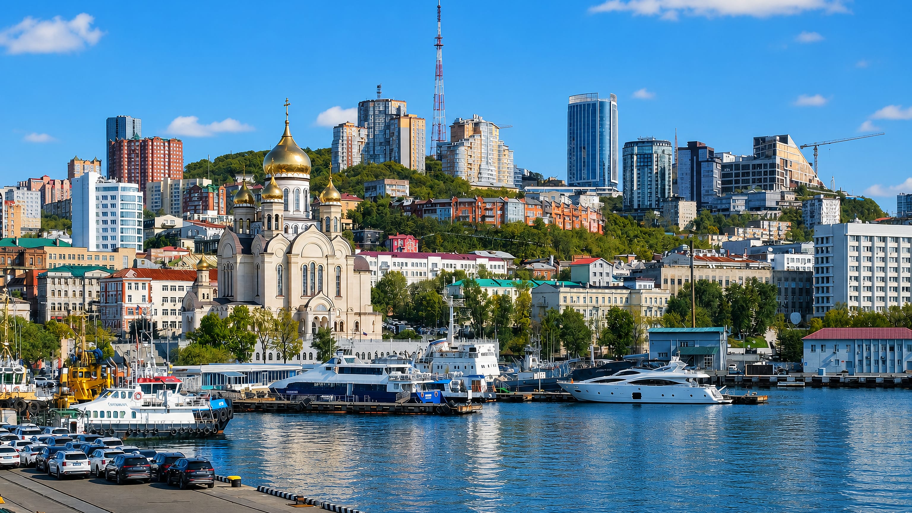 Golden-domed church and hilltop TV tower above the harbour of Vladivostok's Leninsky city district.