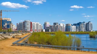 Riverside district of Yakutsk with modern mid-rise apartment blocks fronting a sandy foreshore along the Lena River.