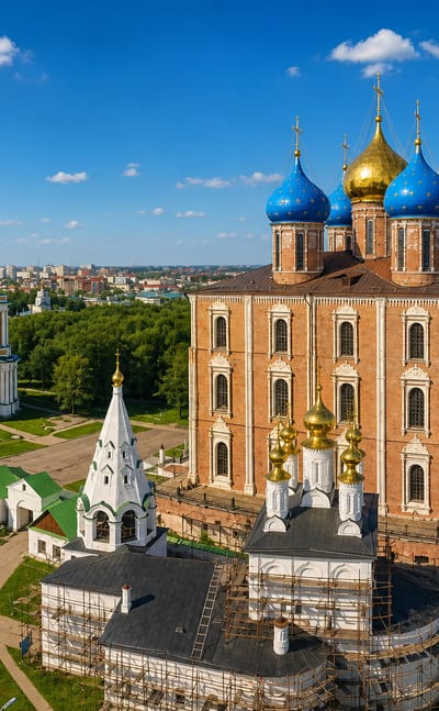 Aerial view of the Ryazan Kremlin with its red-brick cathedral, blue domes and tall bell tower.