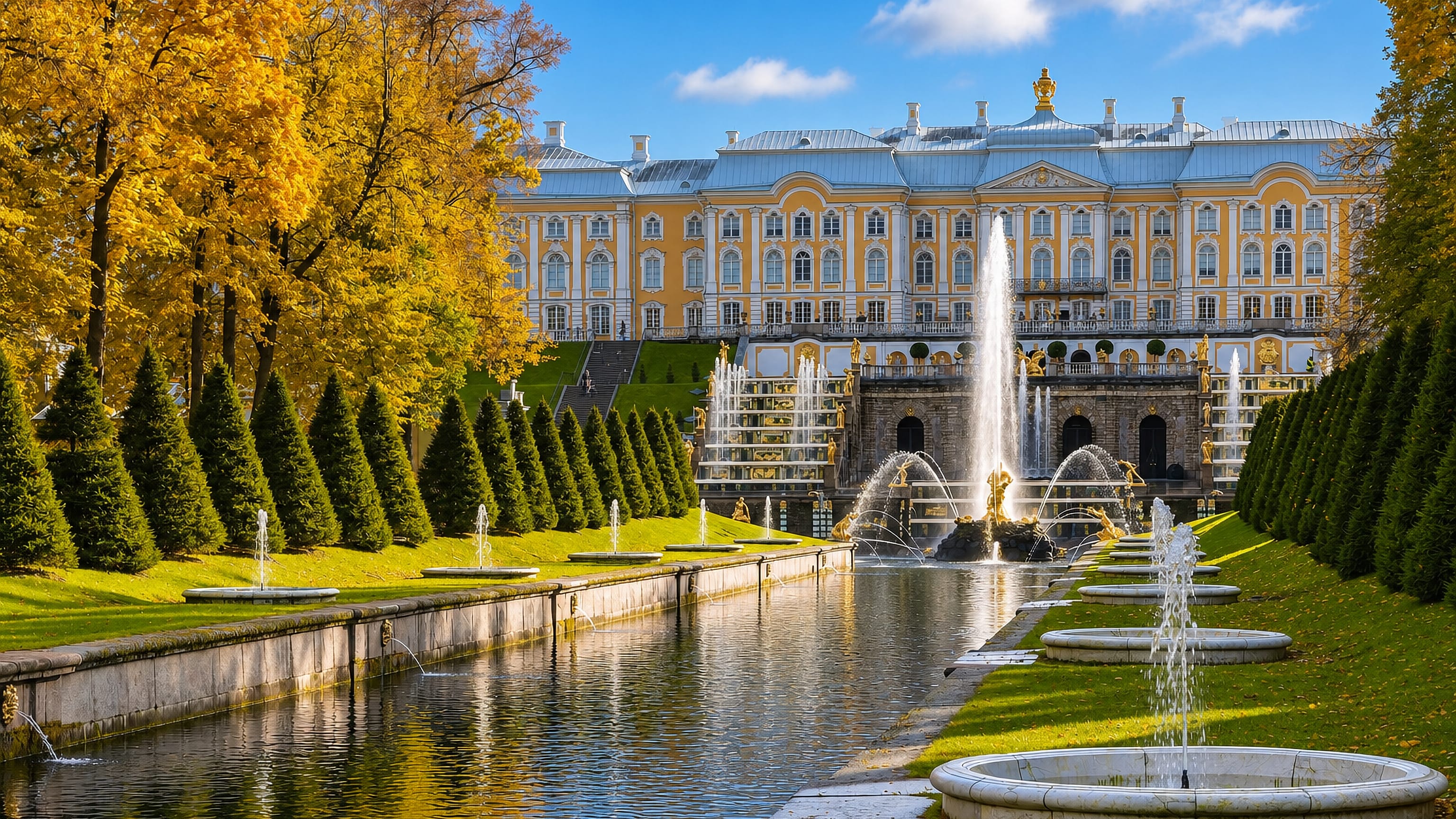 The Grand Palace and Grand Cascade fountains above the Sea Canal at Peterhof on a sunny autumn day.