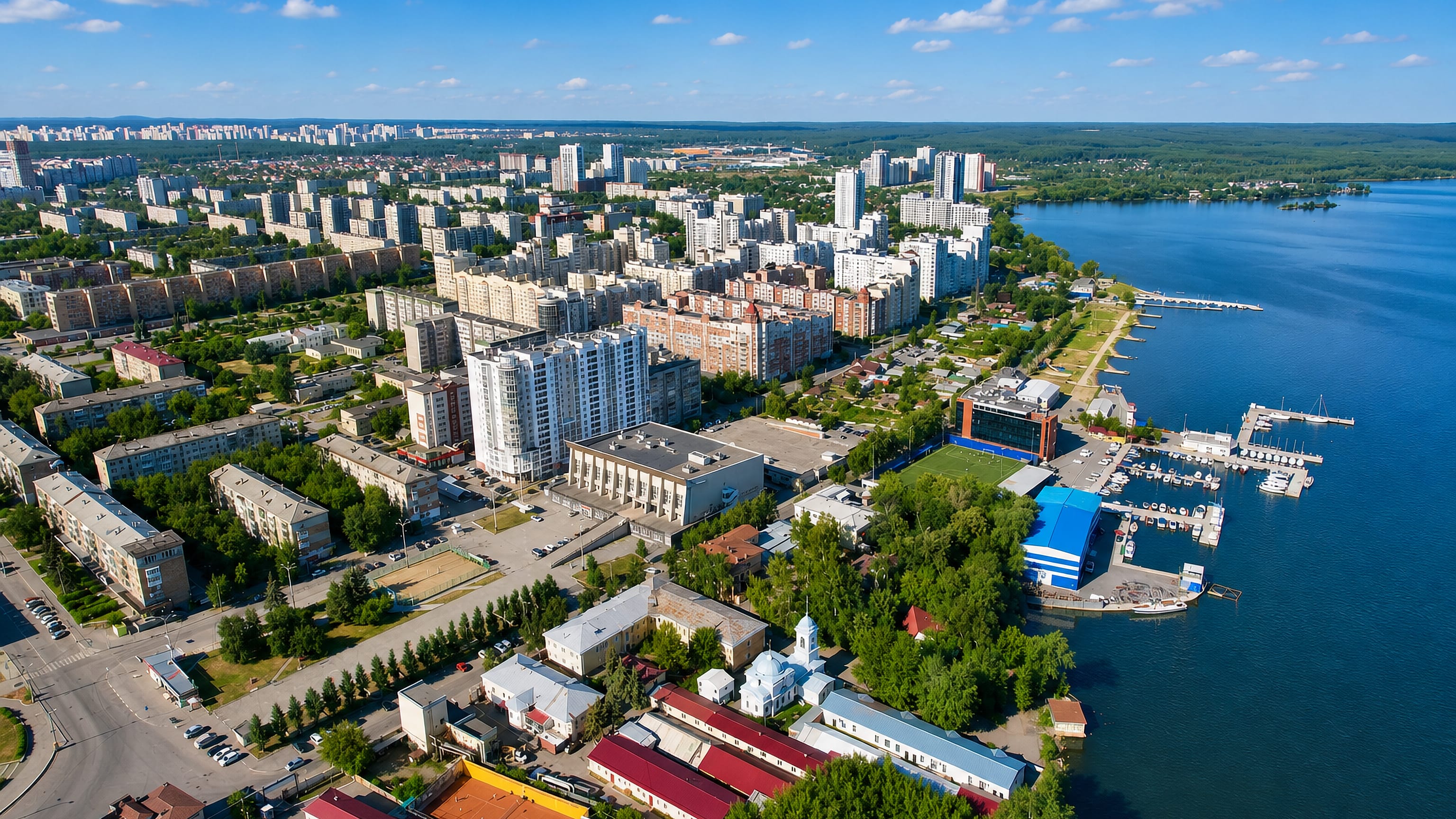 Aerial view over Verch-Isetski district, Yekaterinburg, with apartment blocks lining the Verkh-Isetsky Pond and marina.