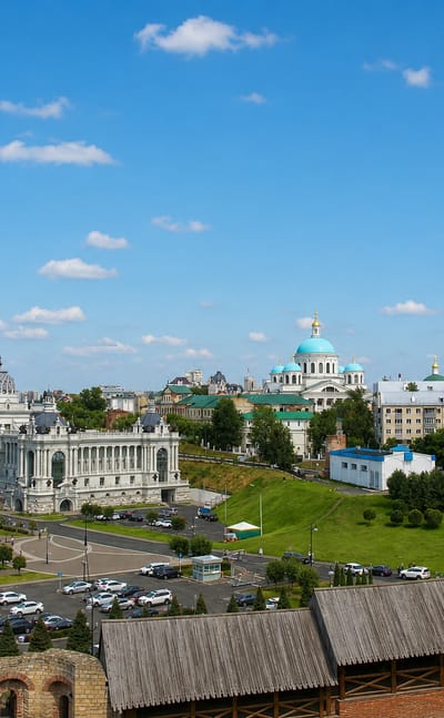 Kazan skyline with the Palace of Farmers, Kremlin walls and golden and blue Orthodox church domes
