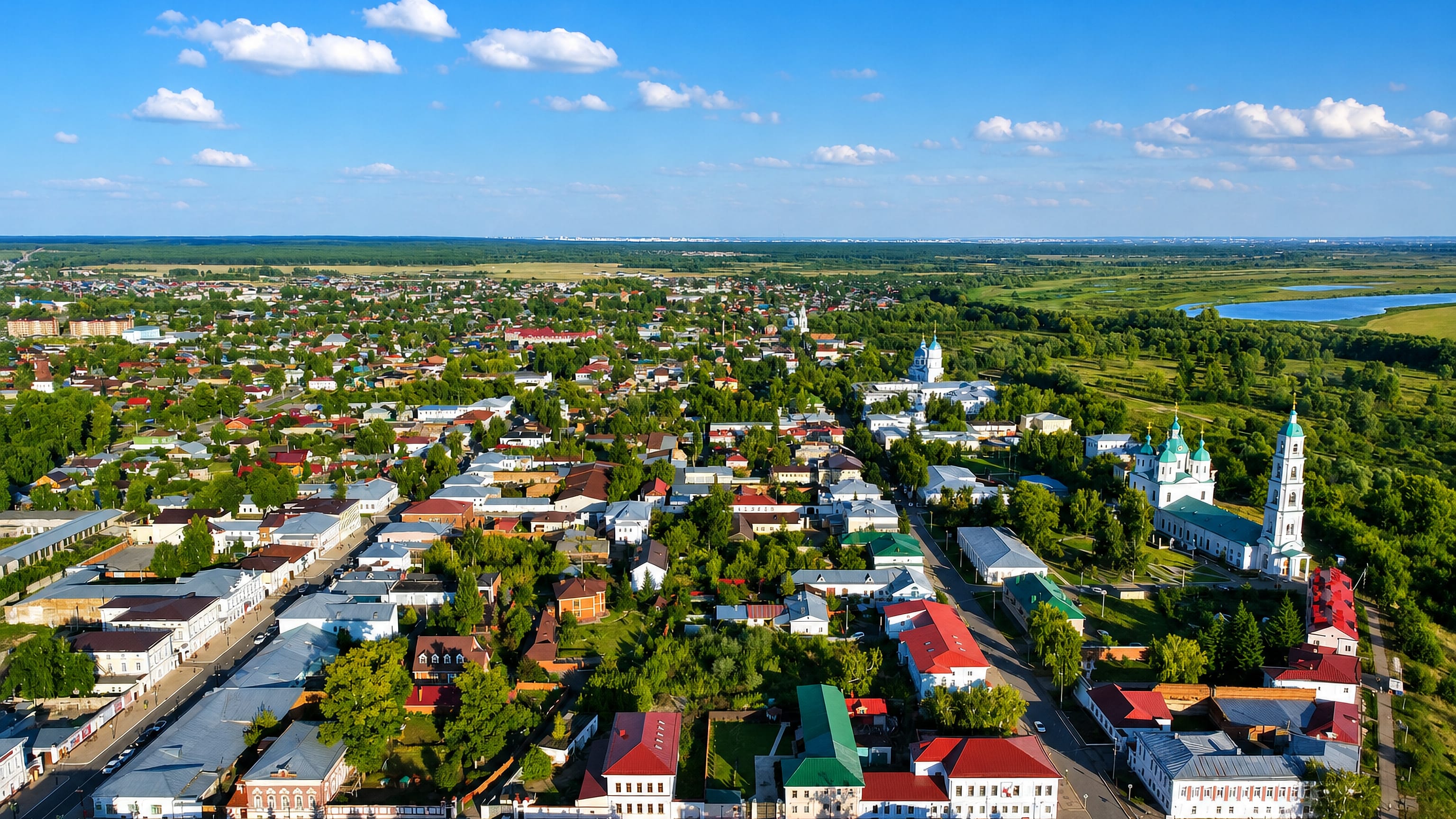 Aerial view of Yelabuga's old town in Tatarstan, with the white Spassky Cathedral and its tall bell tower.