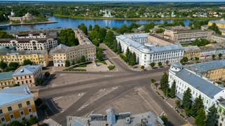 Aerial view of Tver's central square and radiating streets beside the Volga River.