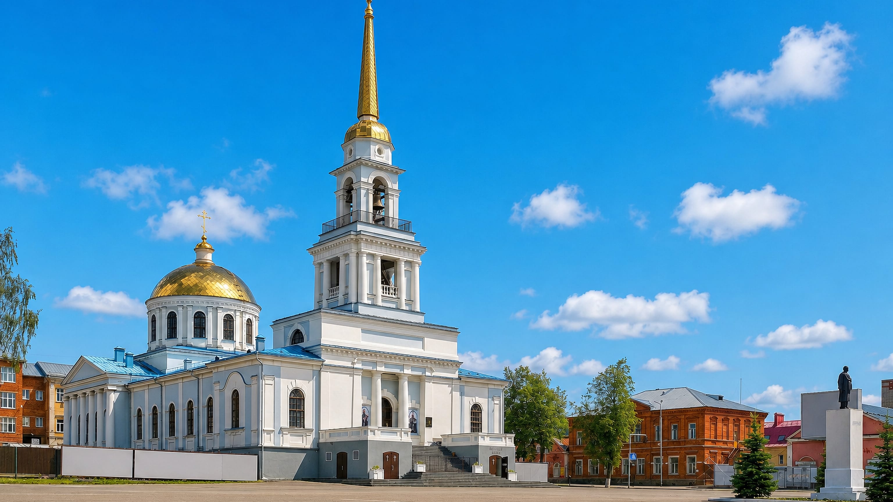 Votkinsk's white Annunciation Cathedral with gold dome and spire on the town's main square, Udmurtia.