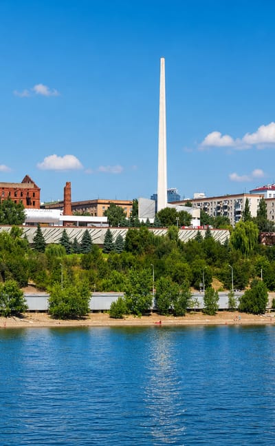 Volgograd waterfront on the Volga with the Panorama Museum rotunda, ruined Gerhardt Mill and a tall obelisk