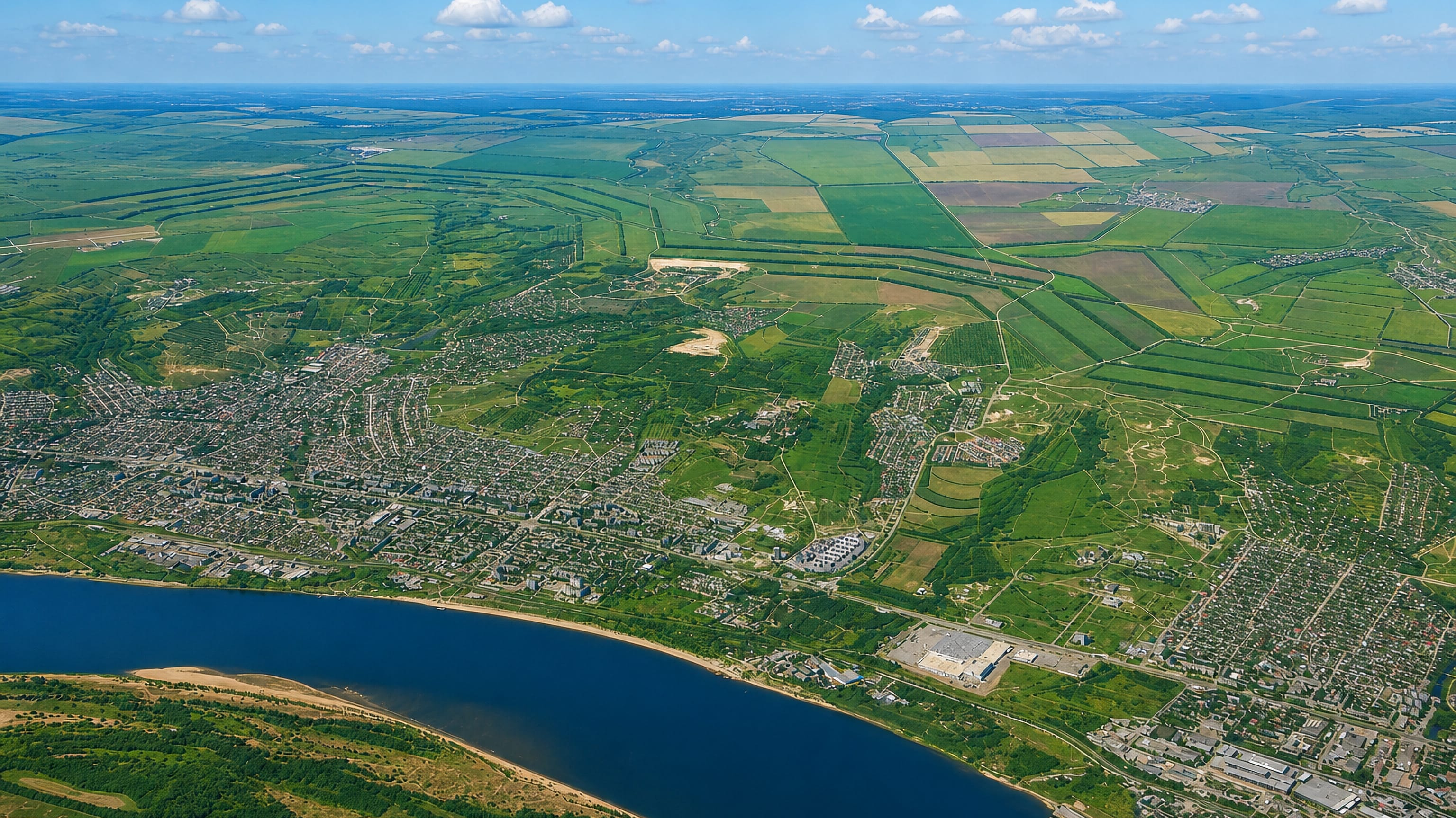 High aerial of Gornaya Polyana on the outskirts of Volgograd, with the Volga and steppe farmland.