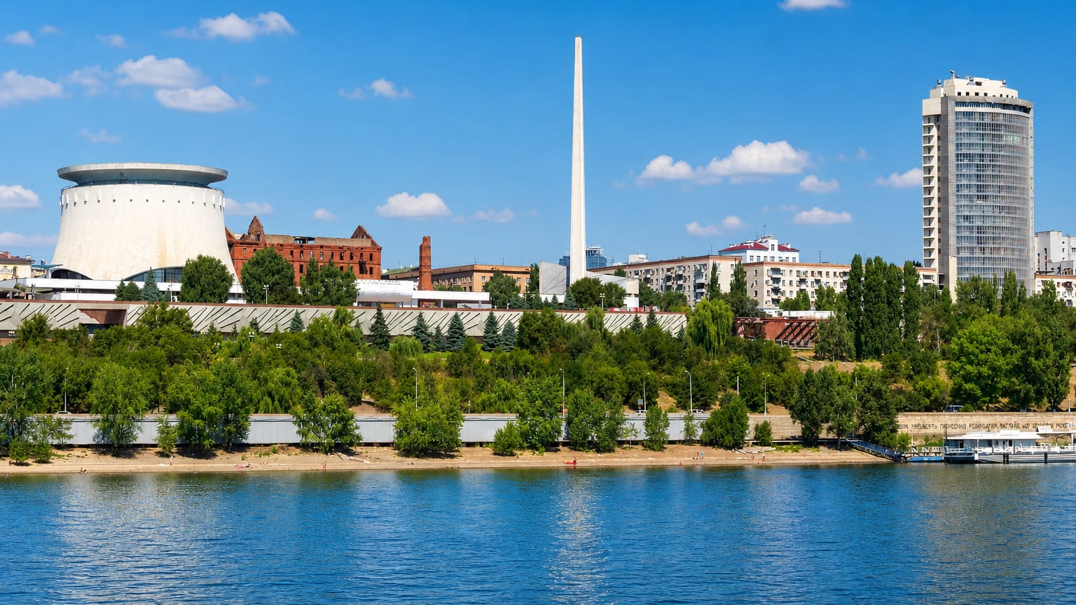 Volgograd waterfront on the Volga with the Panorama Museum rotunda, ruined Gerhardt Mill and a tall obelisk