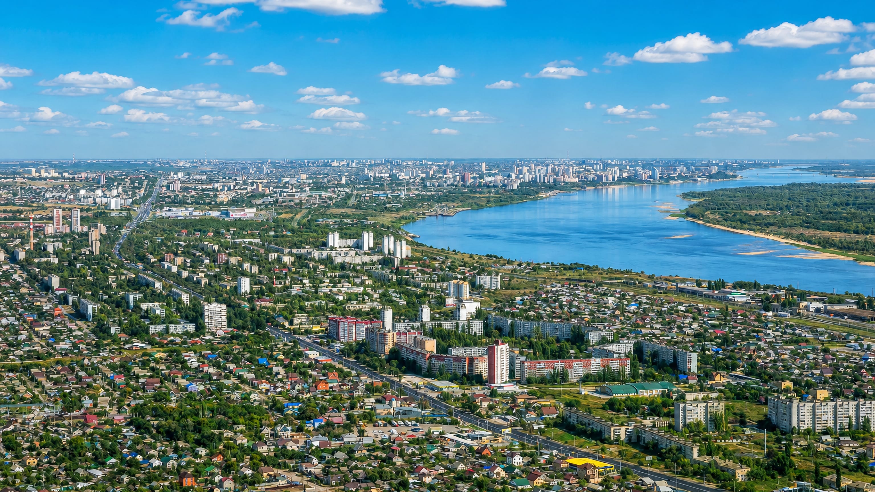 Aerial view of Kirovsky District, Volgograd, its apartment blocks and houses spread along the Volga.