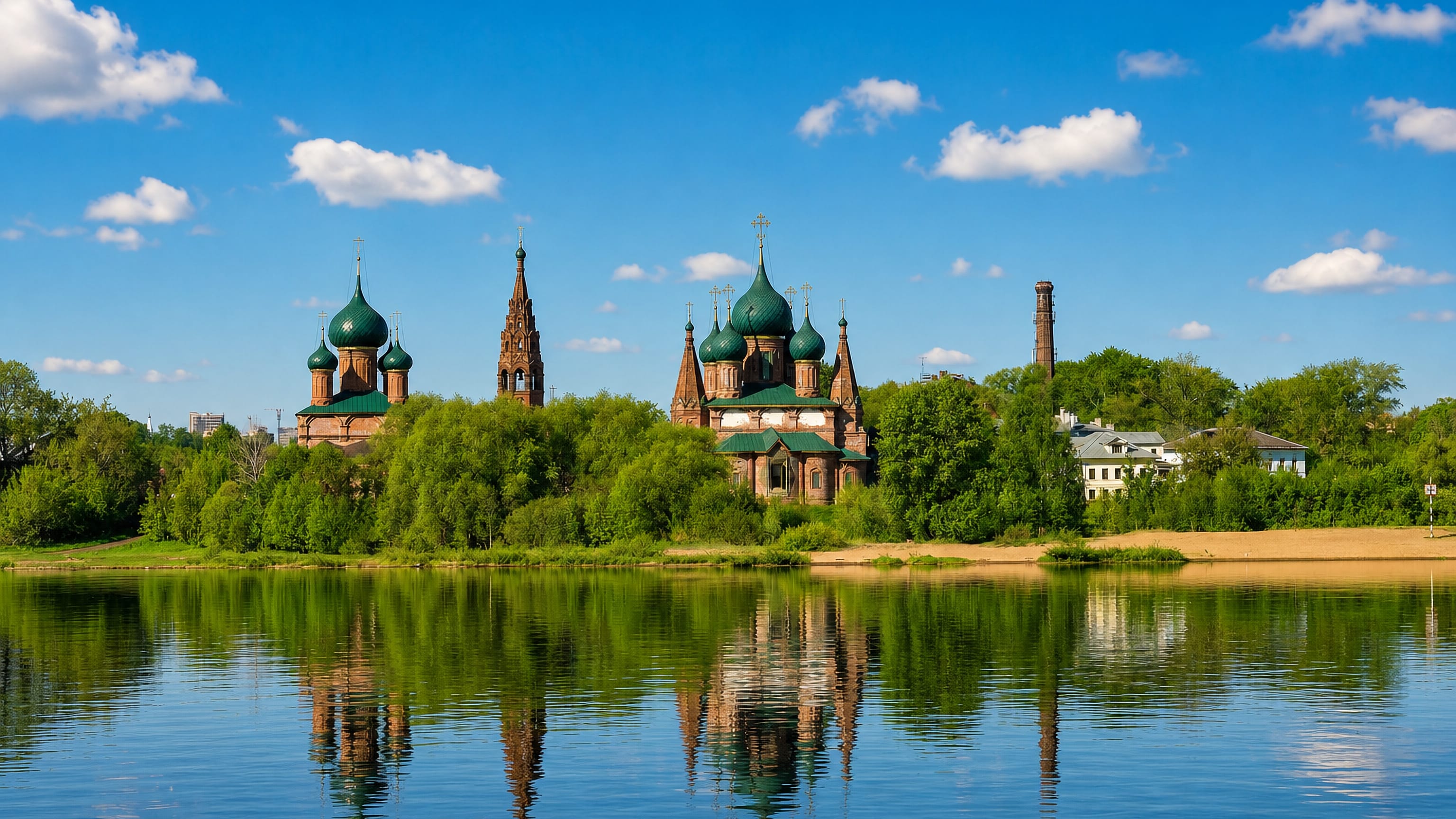 Green-domed Korovniki churches and their bell tower reflected in the Kotorosl river, Yaroslavl.