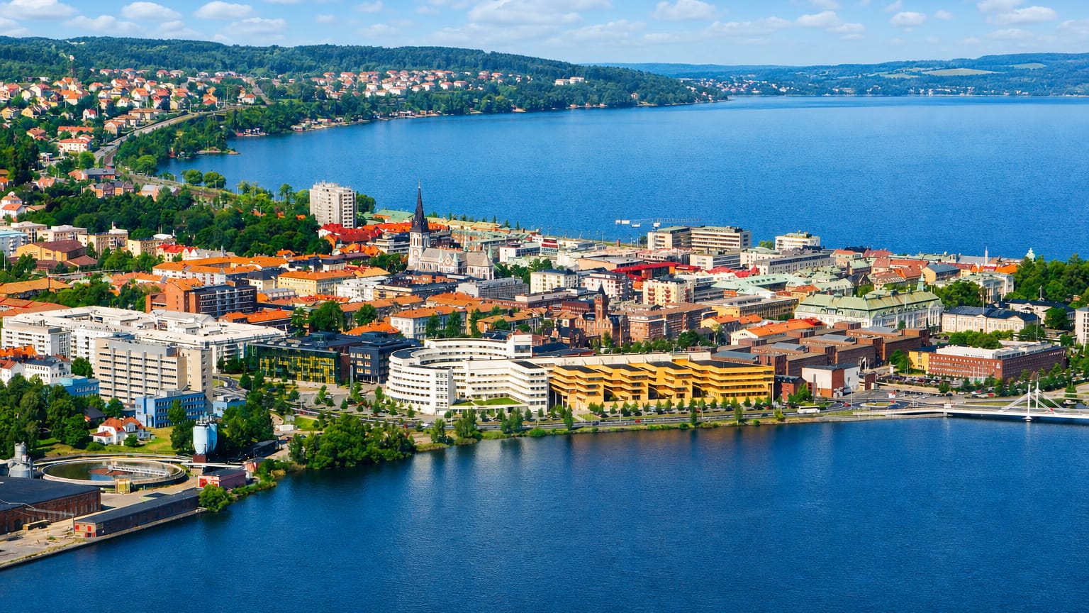 Aerial view of Jonkoping on the southern shore of Lake Vattern with a church spire and mixed rooftops