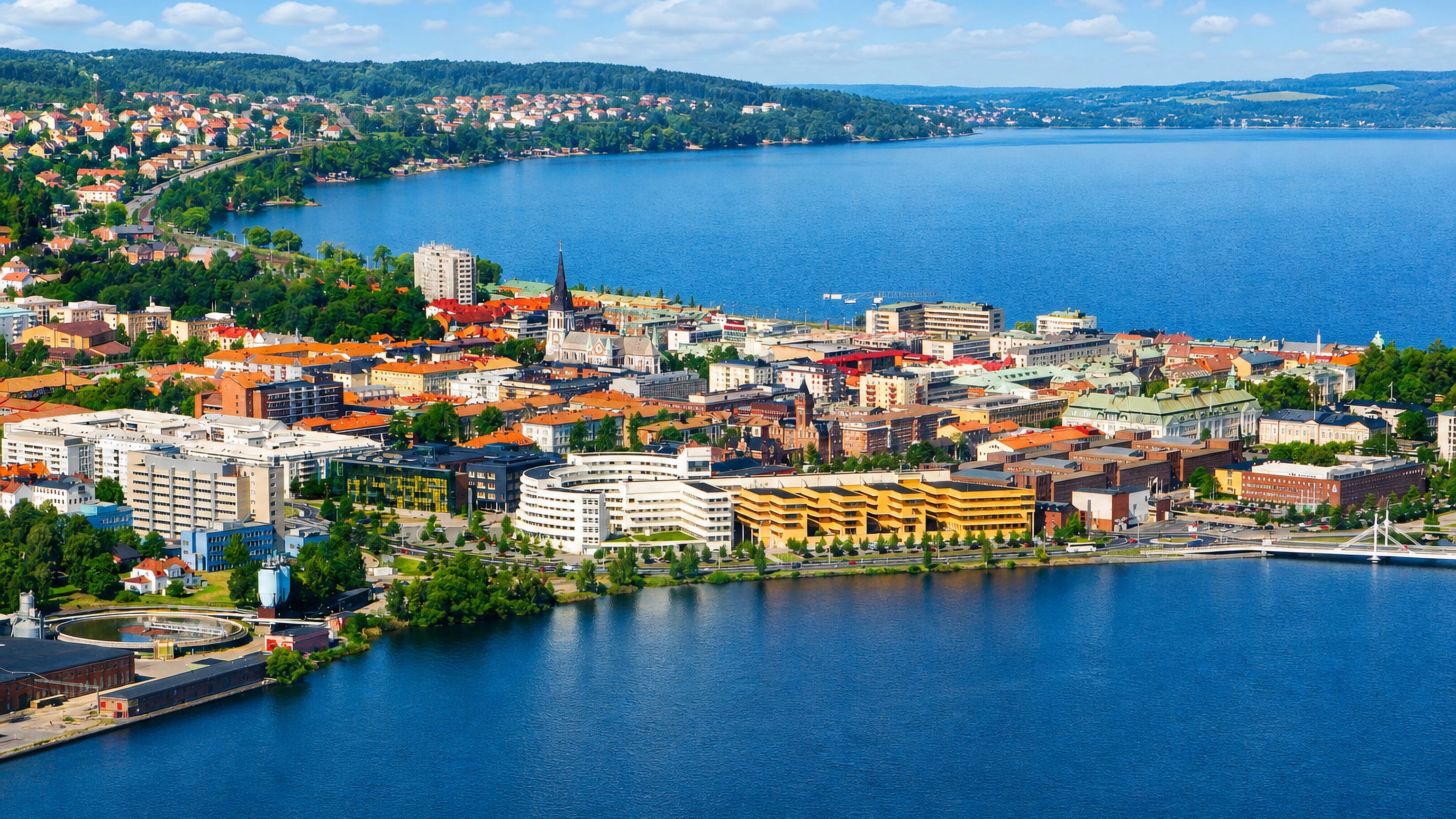 Aerial view of Jonkoping on the southern shore of Lake Vattern with a church spire and mixed rooftops