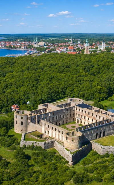 Aerial view of Borgholm Castle ruins above the town and harbour, Oland, Sweden