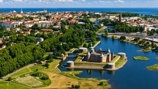 Aerial view of Kalmar Castle on its island moat with the town and Baltic Sea beyond