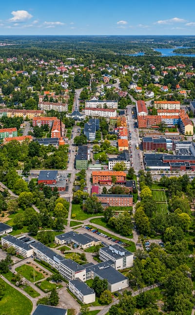 Aerial view of Oskarshamn's colourful town centre, water tower and harbour on the Baltic archipelago coast.
